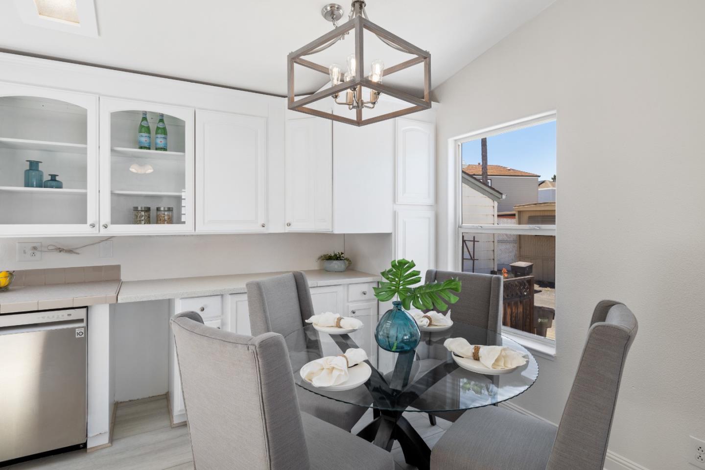 14685 Oka Road, Unit 62 Los Gatos, CA 95032 - Photo 8 of 27 a dining room with furniture and wooden floor