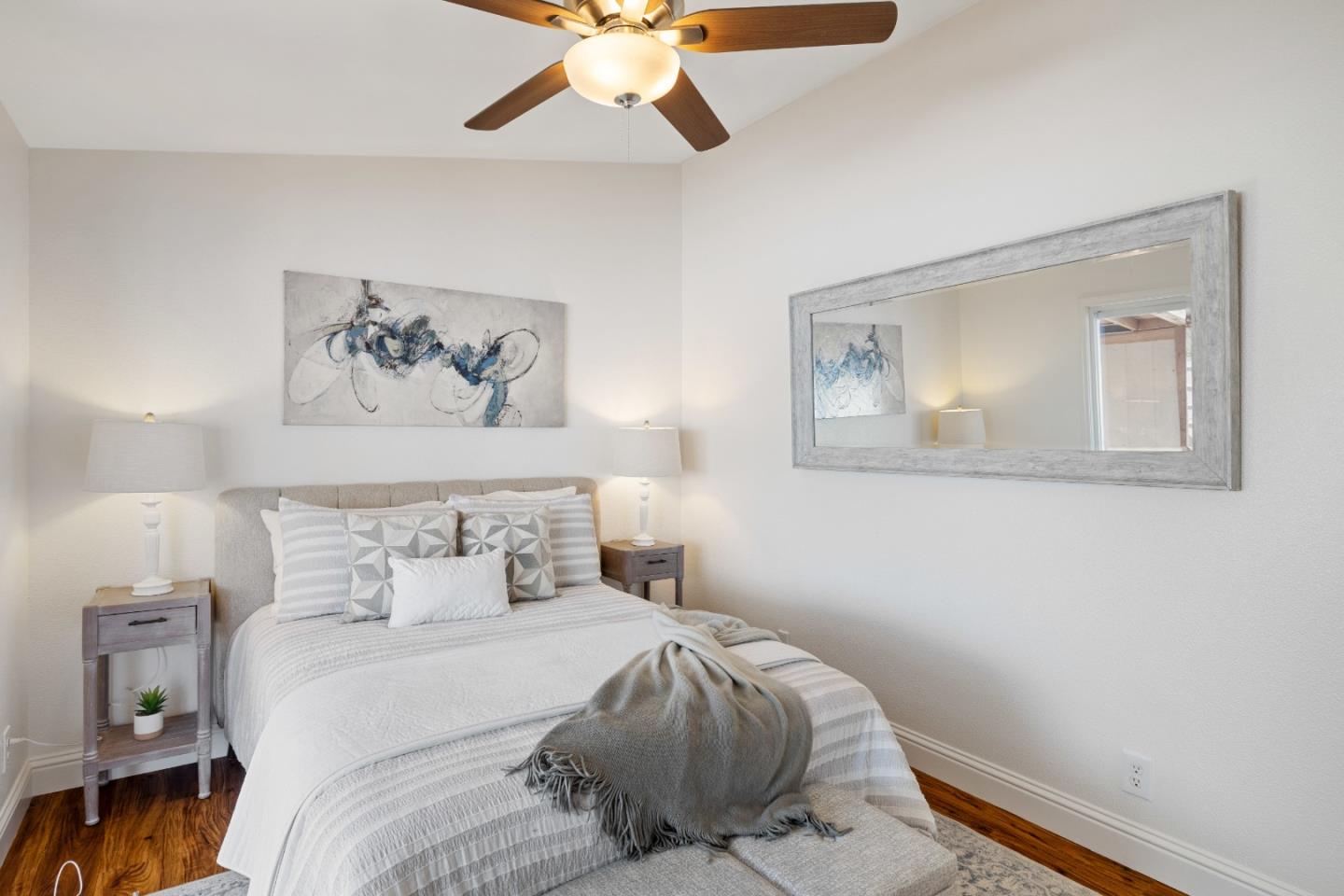 14685 Oka Road, Unit 62 Los Gatos, CA 95032 - Photo 9 of 27 a bedroom with a bed and a painting on the wall