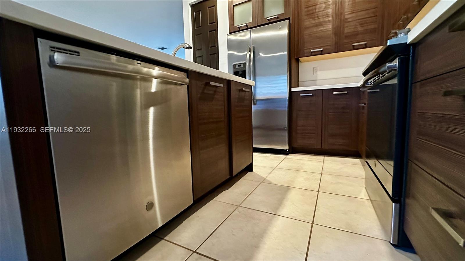 9155 Northwest 161st Street Miami Lakes, FL 33018 - Photo 16 of 51 a bathroom with a glass door shower
