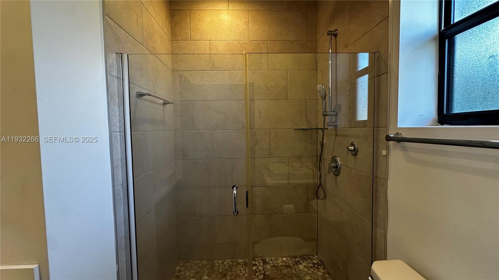 9155 Northwest 161st Street Miami Lakes, FL 33018 - Photo 30 of 51 a bathroom with a shower