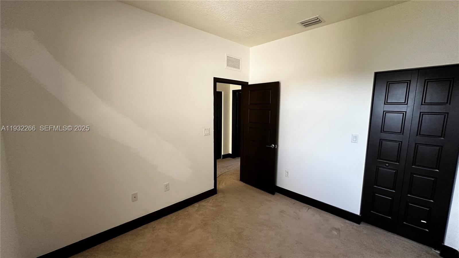 9155 Northwest 161st Street Miami Lakes, FL 33018 - Photo 34 of 51 an empty room with closet
