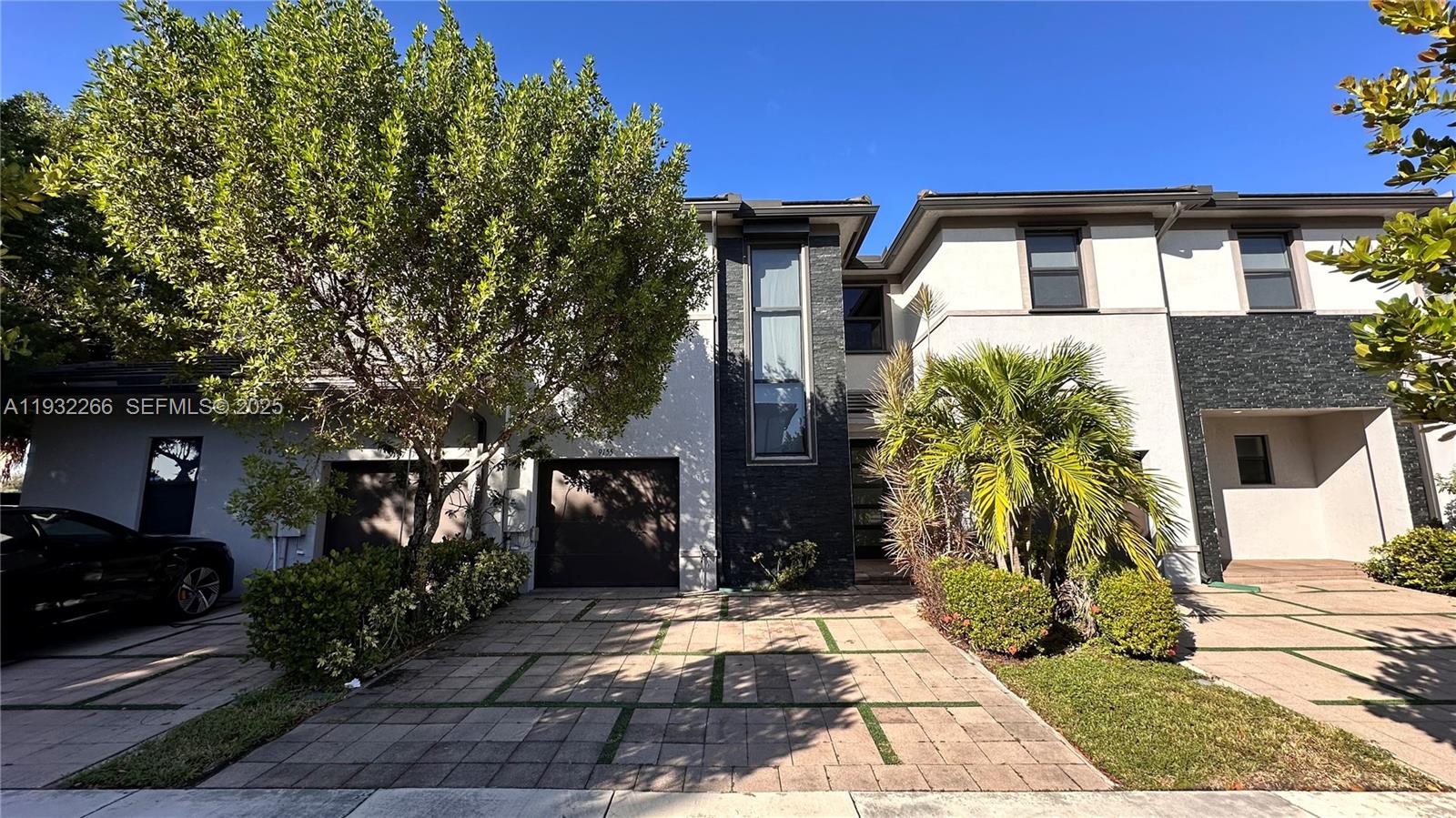 9155 Northwest 161st Street Miami Lakes, FL 33018 - Photo 45 of 51 a front view of a house with garden