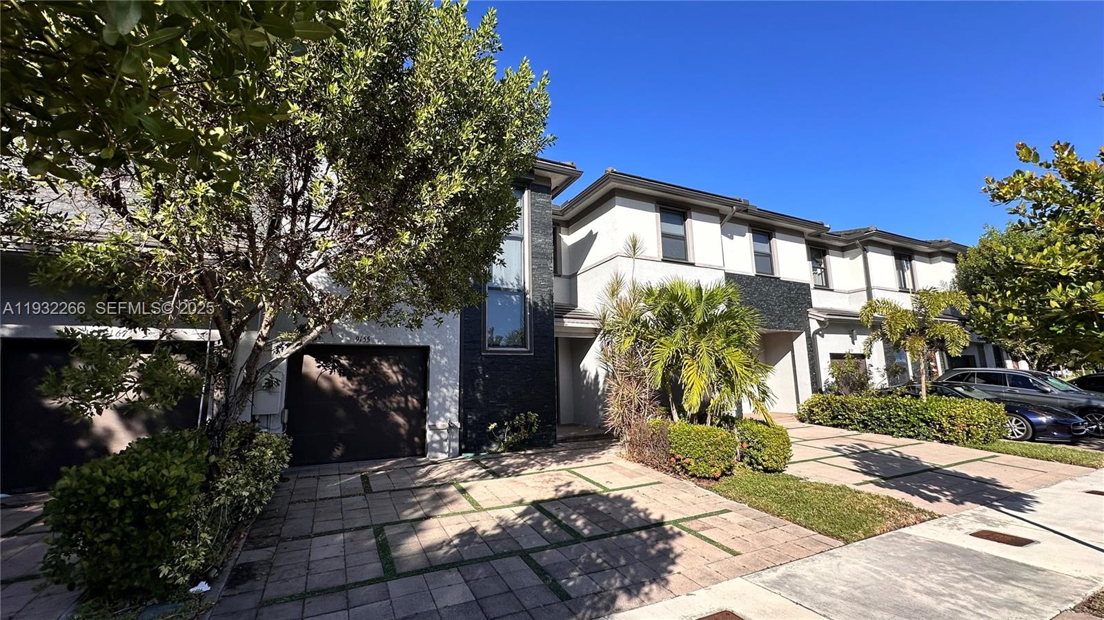 9155 Northwest 161st Street Miami Lakes, FL 33018 - Photo 46 of 51 a front view of a house with a yard