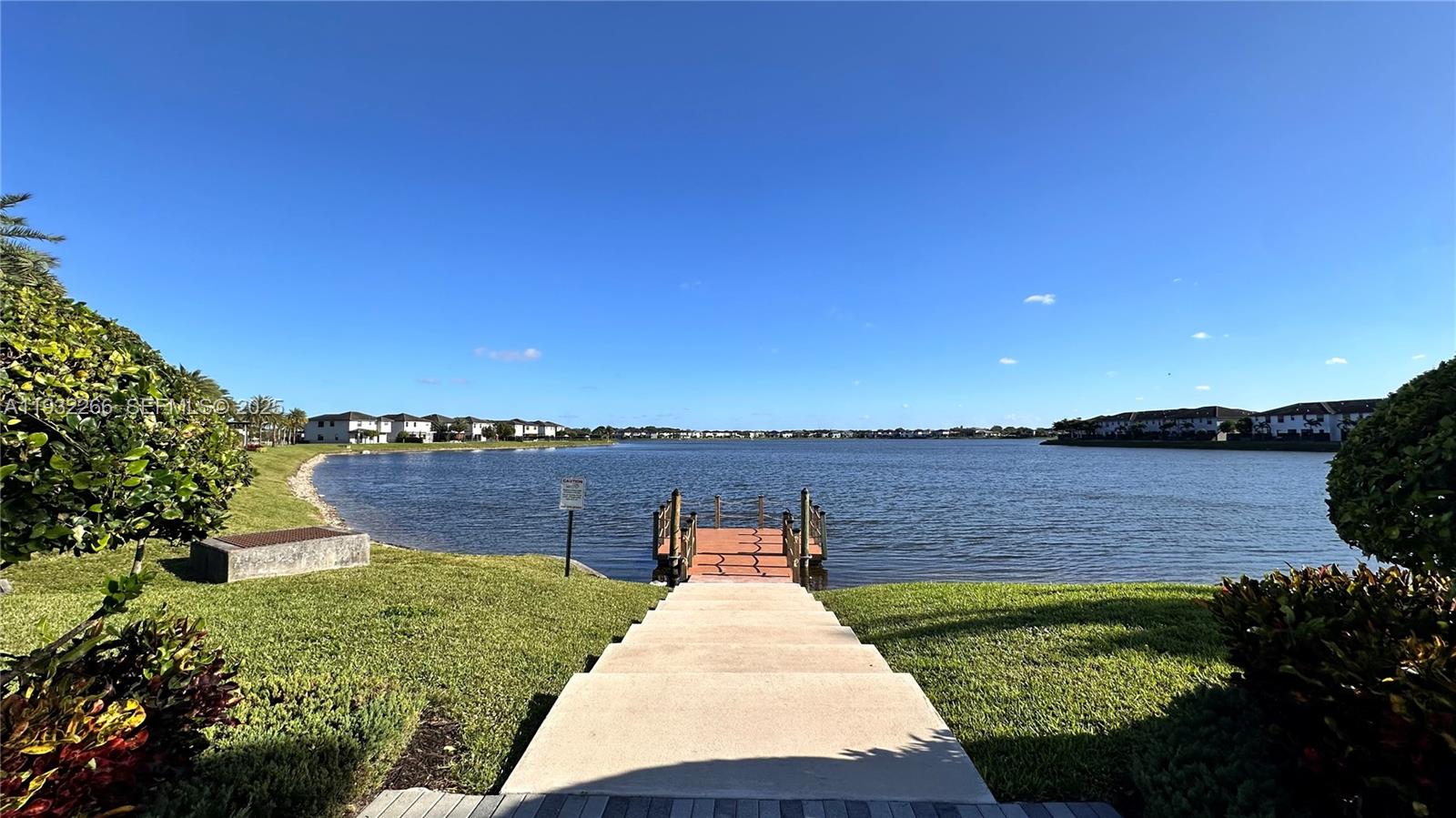 9155 Northwest 161st Street Miami Lakes, FL 33018 - Photo 51 of 51 a view of a lake with a garden and stairs