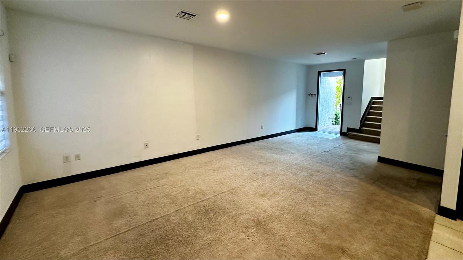 9155 Northwest 161st Street Miami Lakes, FL 33018 - Photo 6 of 51 an empty room with windows