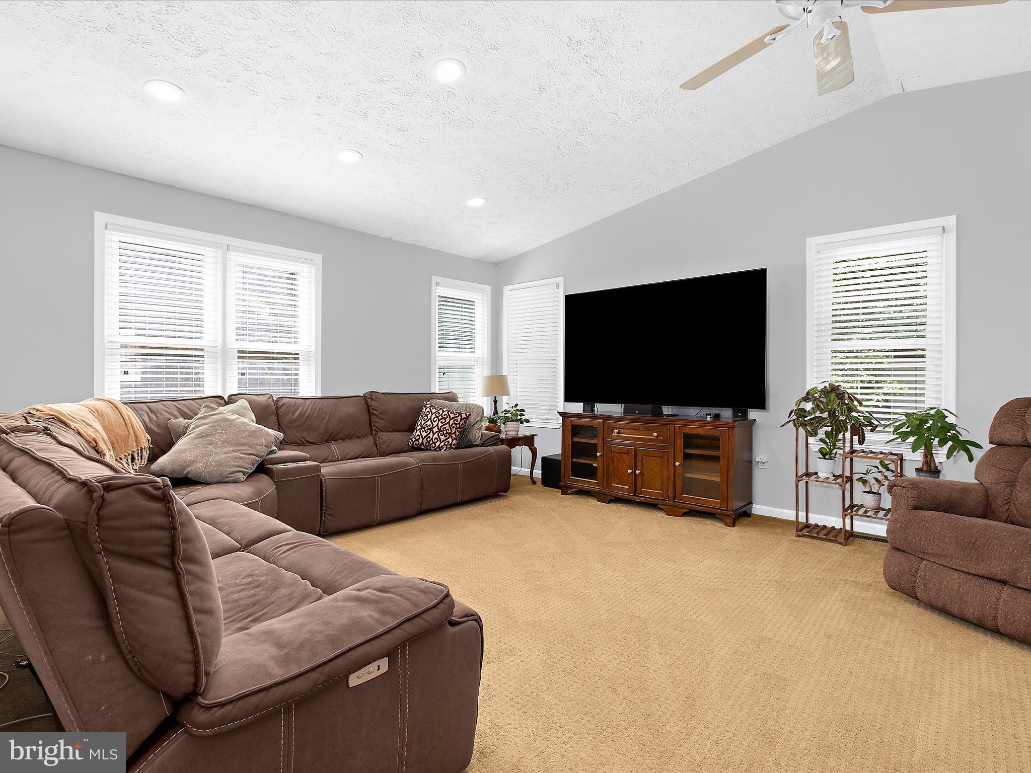 1217 Somerset Road Severn, MD 21144 - Photo 14 of 86 a living room with furniture and a flat screen tv