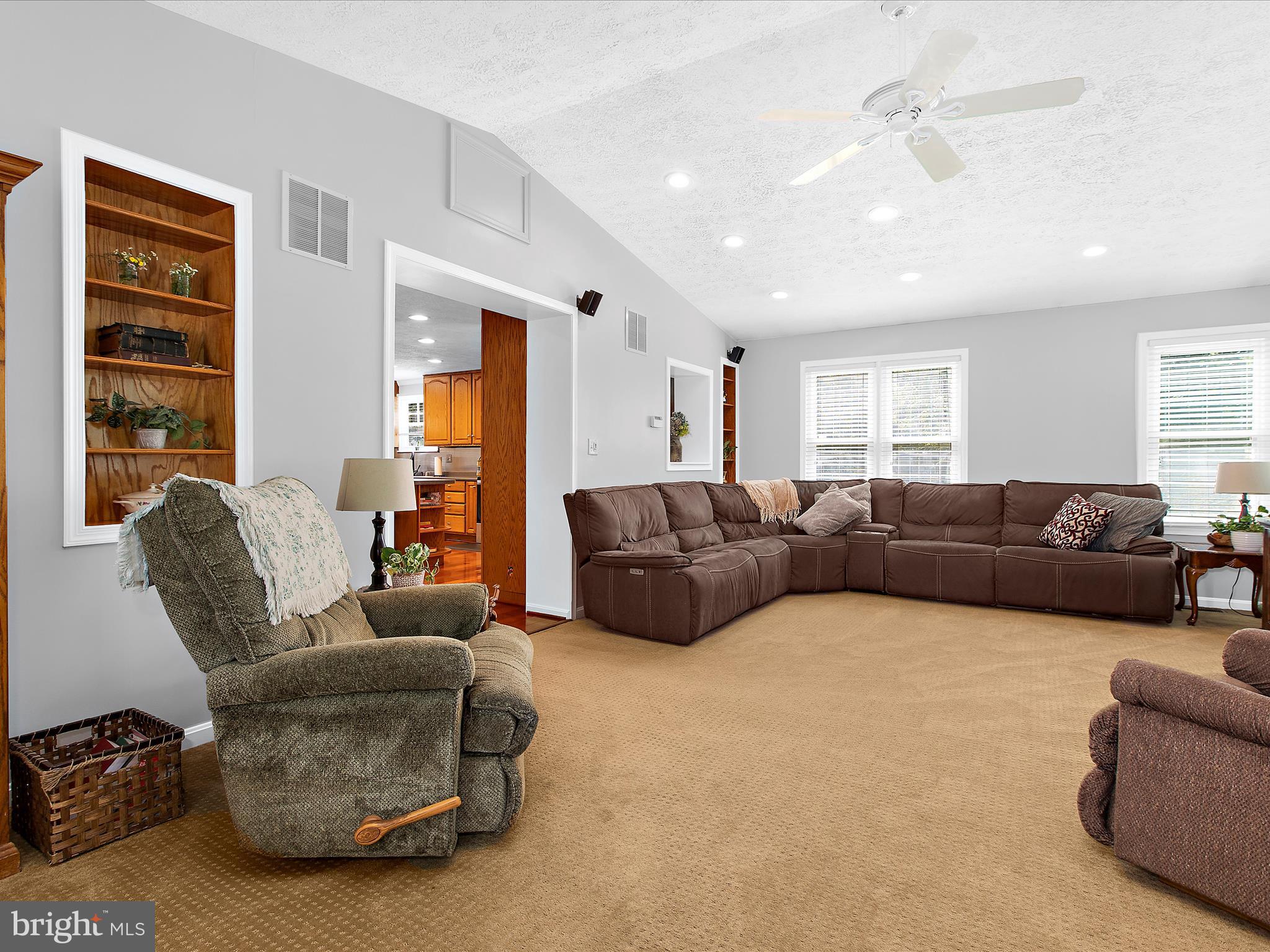 1217 Somerset Road Severn, MD 21144 - Photo 16 of 86 a living room with furniture ceiling fan and a window