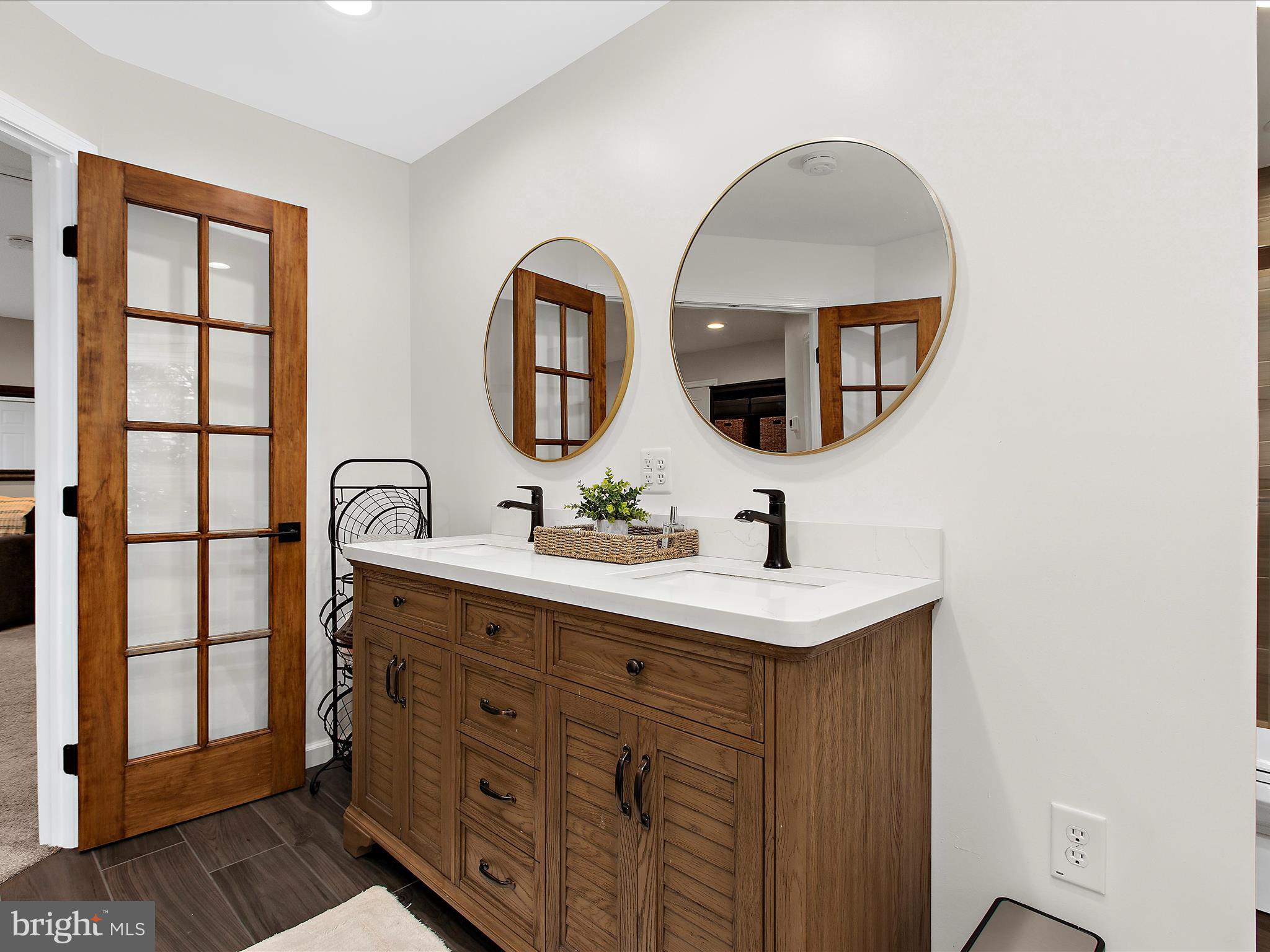 1217 Somerset Road Severn, MD 21144 - Photo 26 of 86 a bathroom with a sink and a mirror