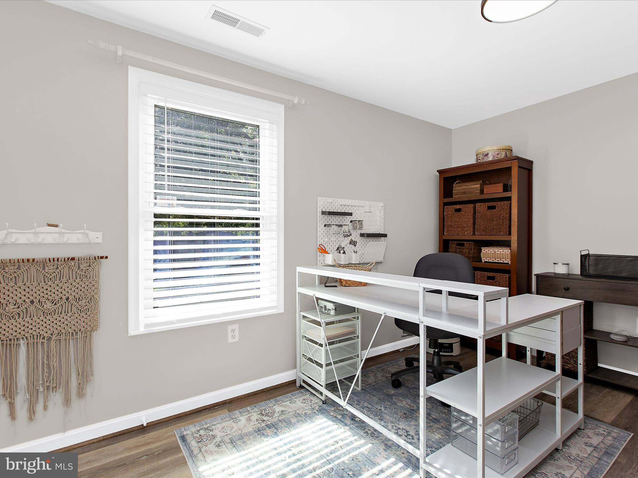 1217 Somerset Road Severn, MD 21144 - Photo 33 of 86 a view of a workspace with furniture and a window