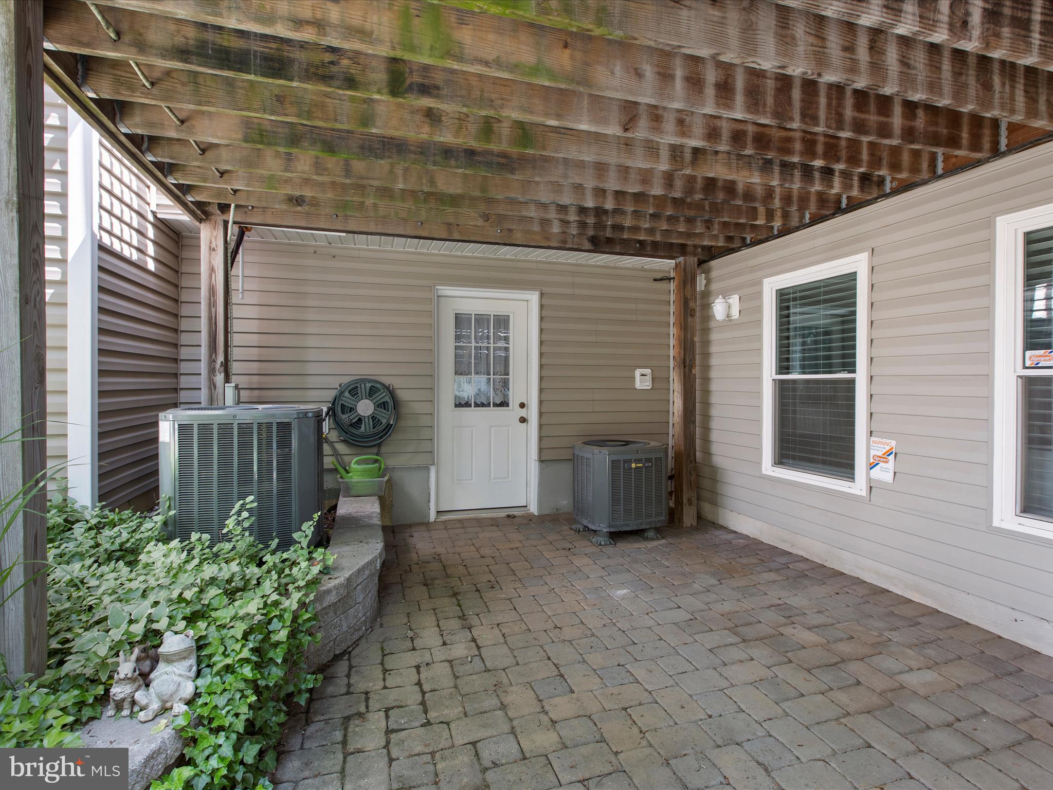 1217 Somerset Road Severn, MD 21144 - Photo 70 of 86 a view of a porch with potted plants