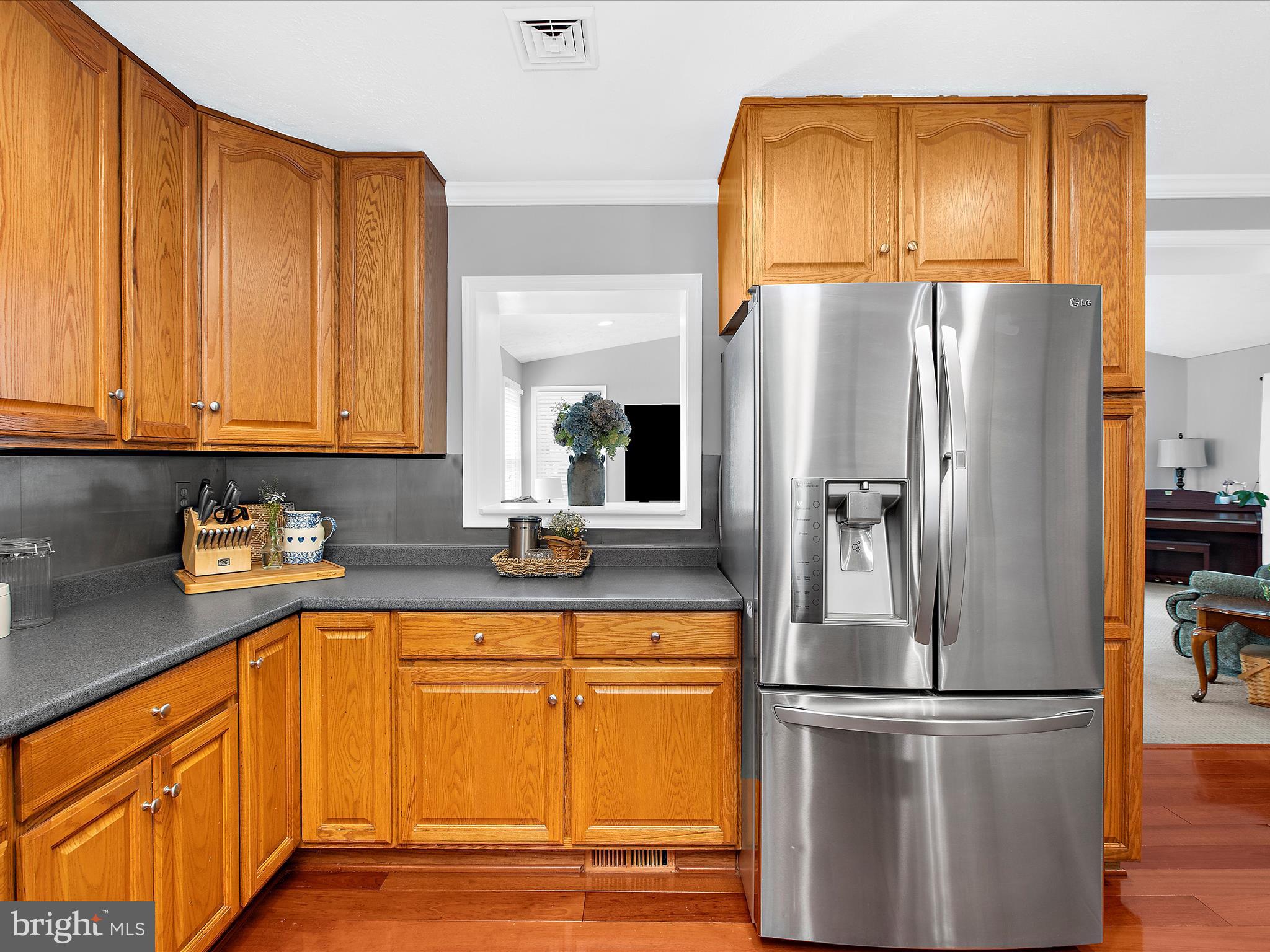 1217 Somerset Road Severn, MD 21144 - Photo 10 of 86 a kitchen with stainless steel appliances granite countertop a refrigerator sink and cabinets