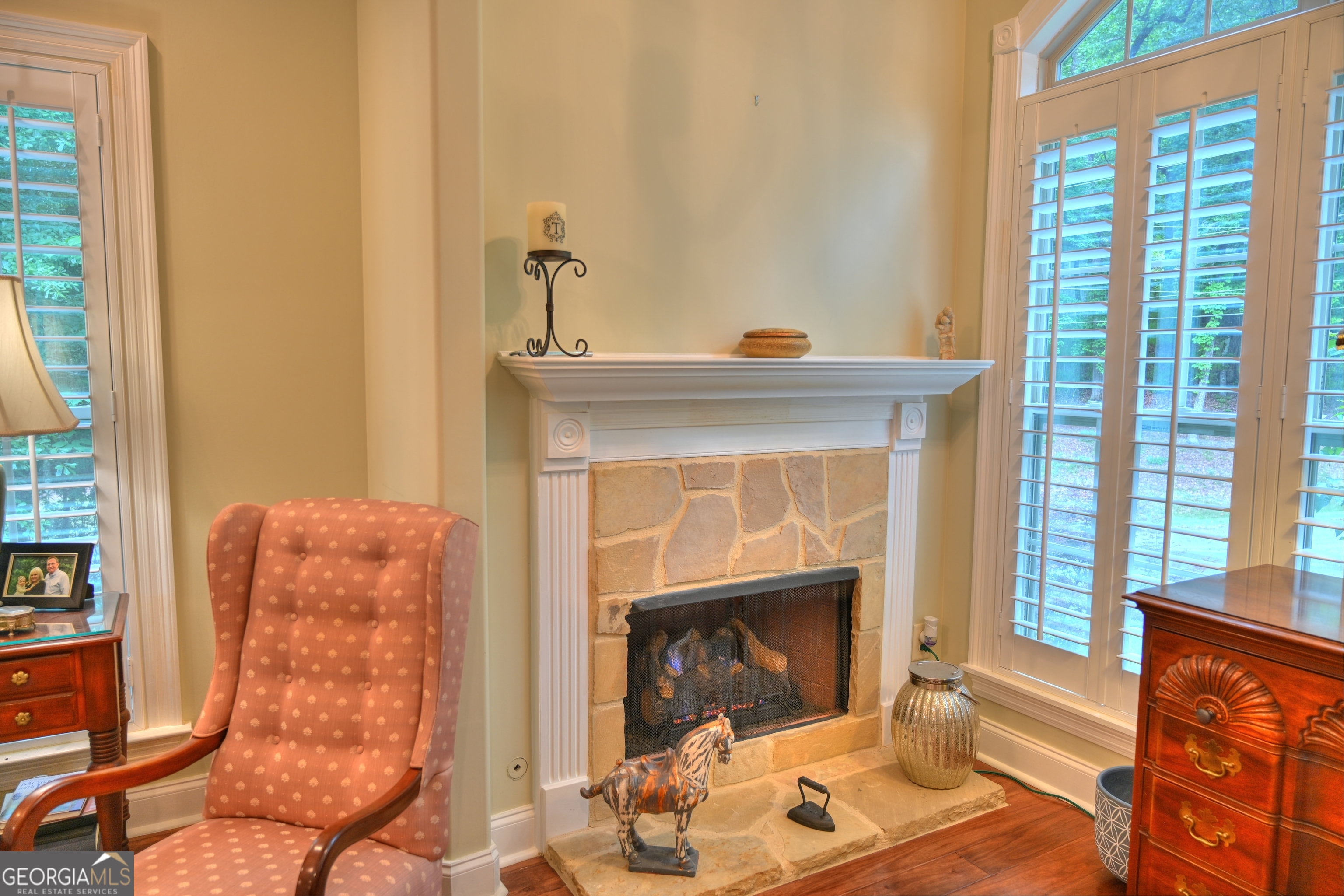 7381 Lullwater Road Columbus, GA 31904 - Photo 14 of 47 a living room with furniture and a fireplace