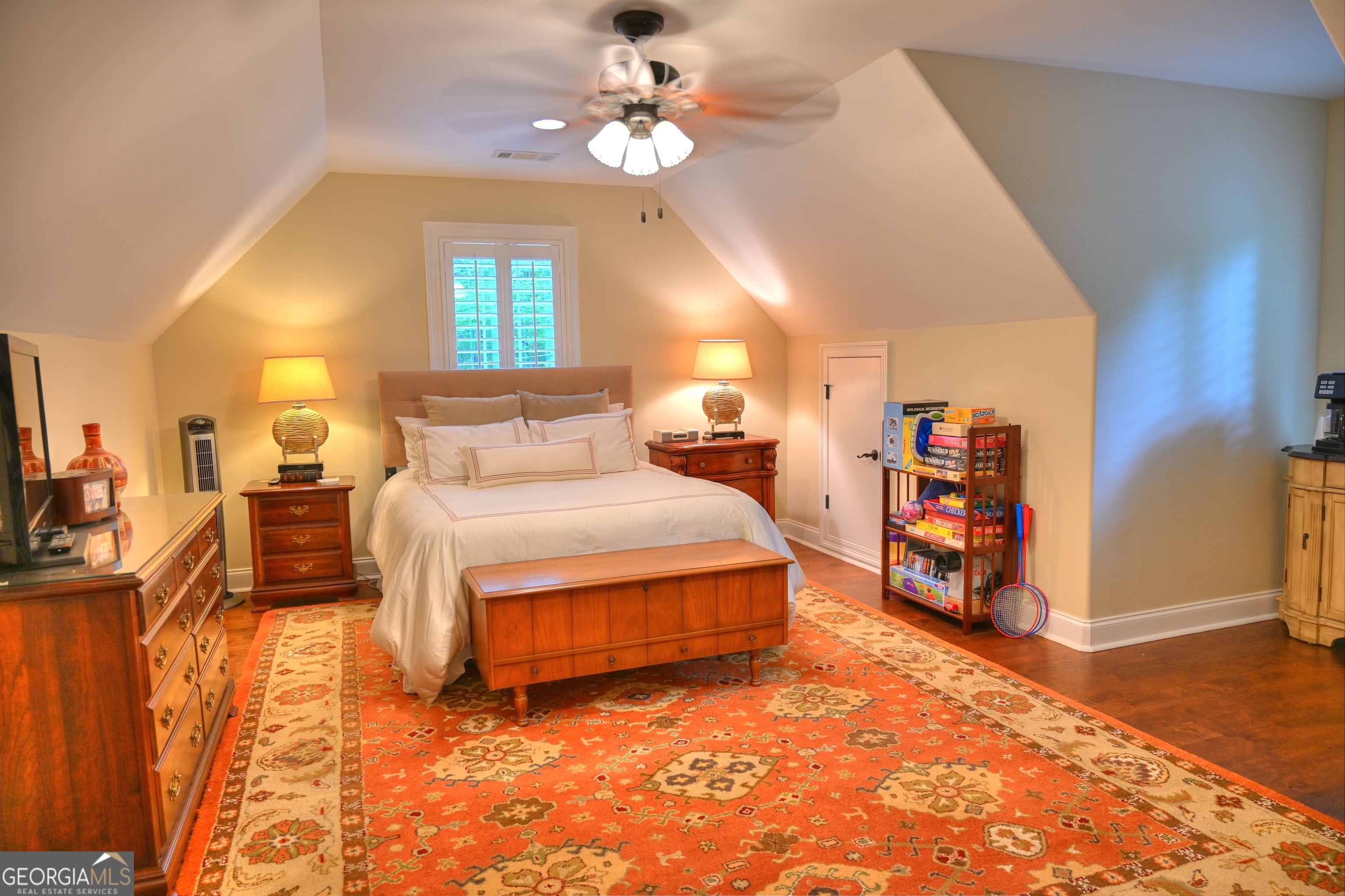 7381 Lullwater Road Columbus, GA 31904 - Photo 16 of 47 a spacious bedroom with a bed and a chandelier