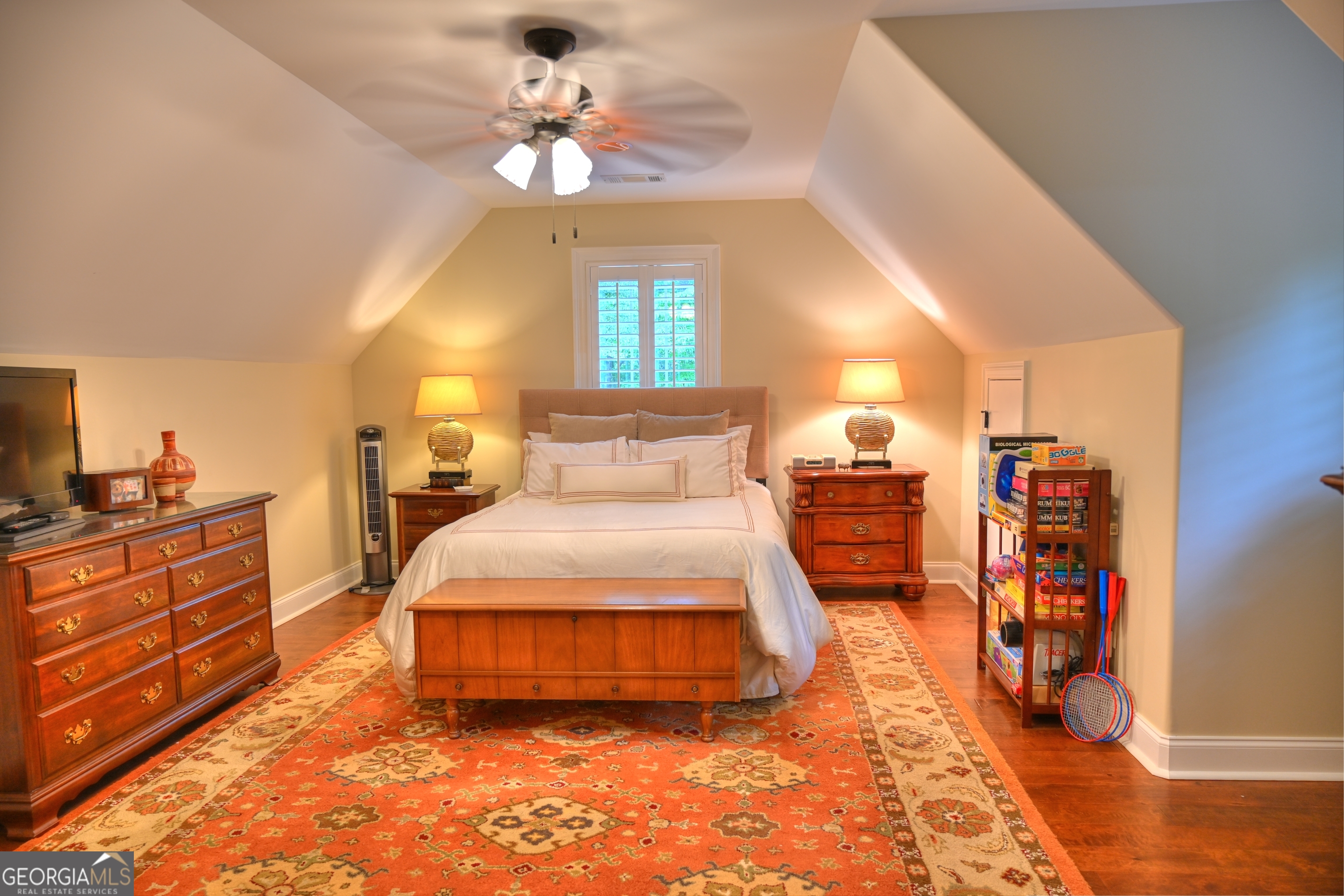 7381 Lullwater Road Columbus, GA 31904 - Photo 18 of 47 a spacious bedroom with a bed and a chandelier
