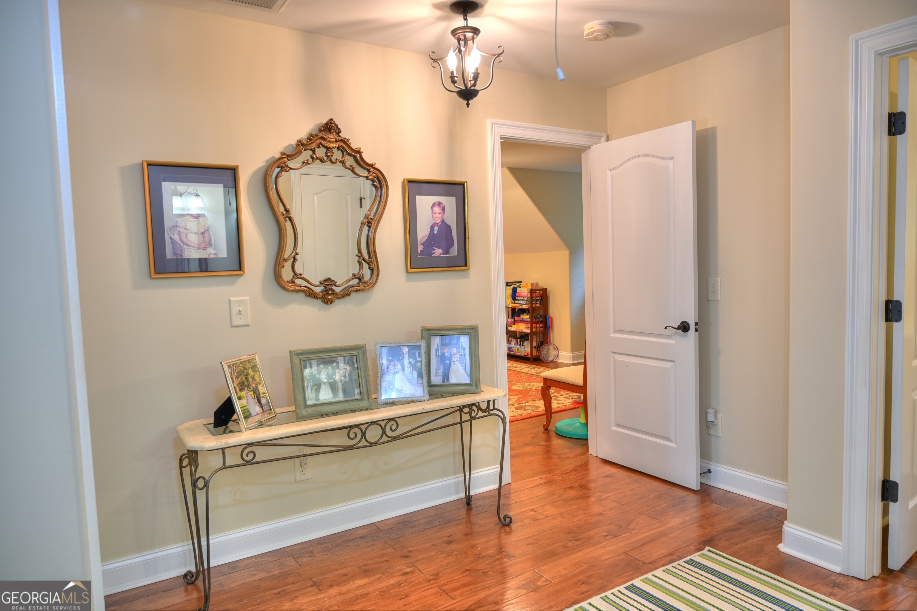 7381 Lullwater Road Columbus, GA 31904 - Photo 19 of 47 a room with wooden floor and furniture