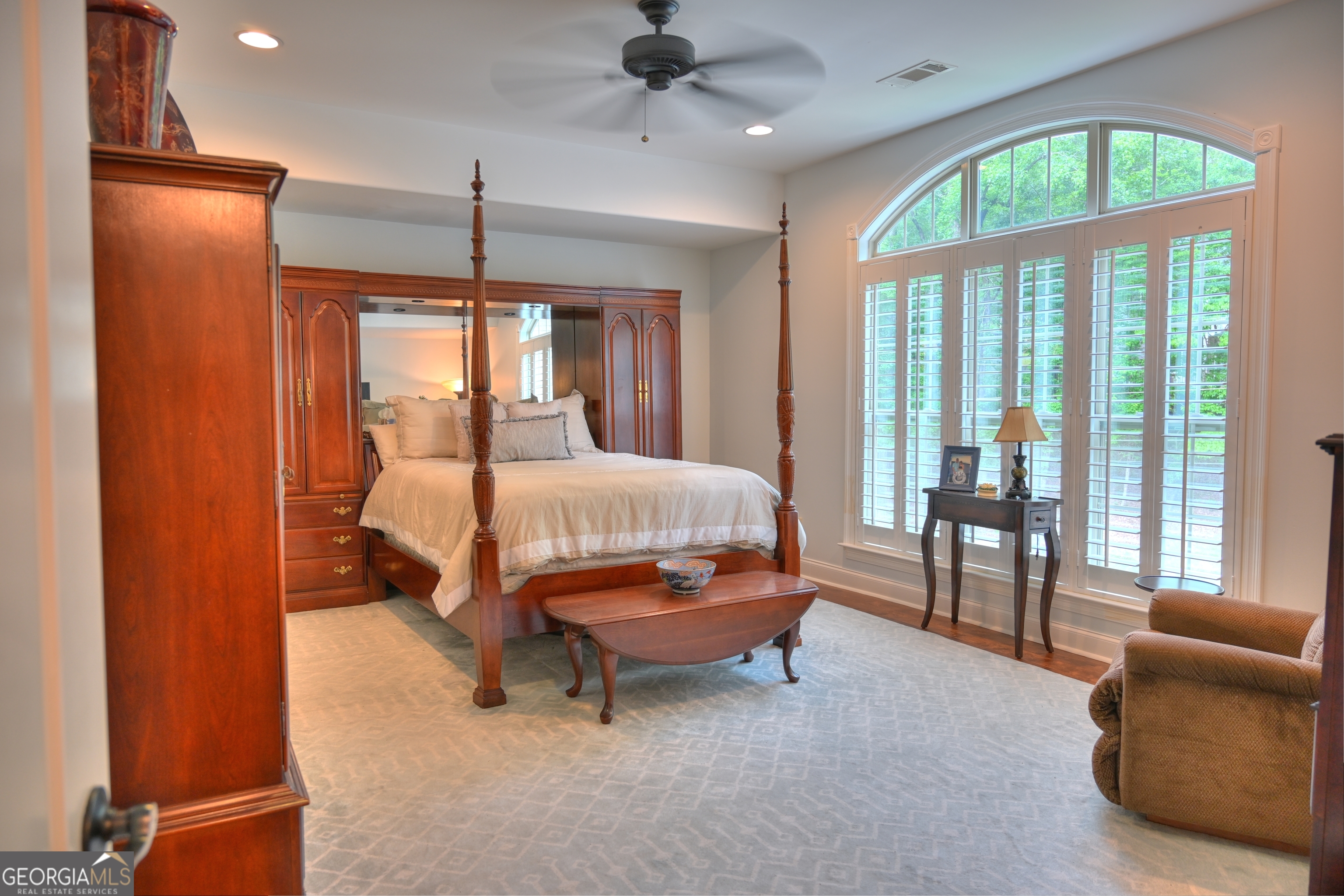 7381 Lullwater Road Columbus, GA 31904 - Photo 21 of 47 a bedroom with a bed and large windows