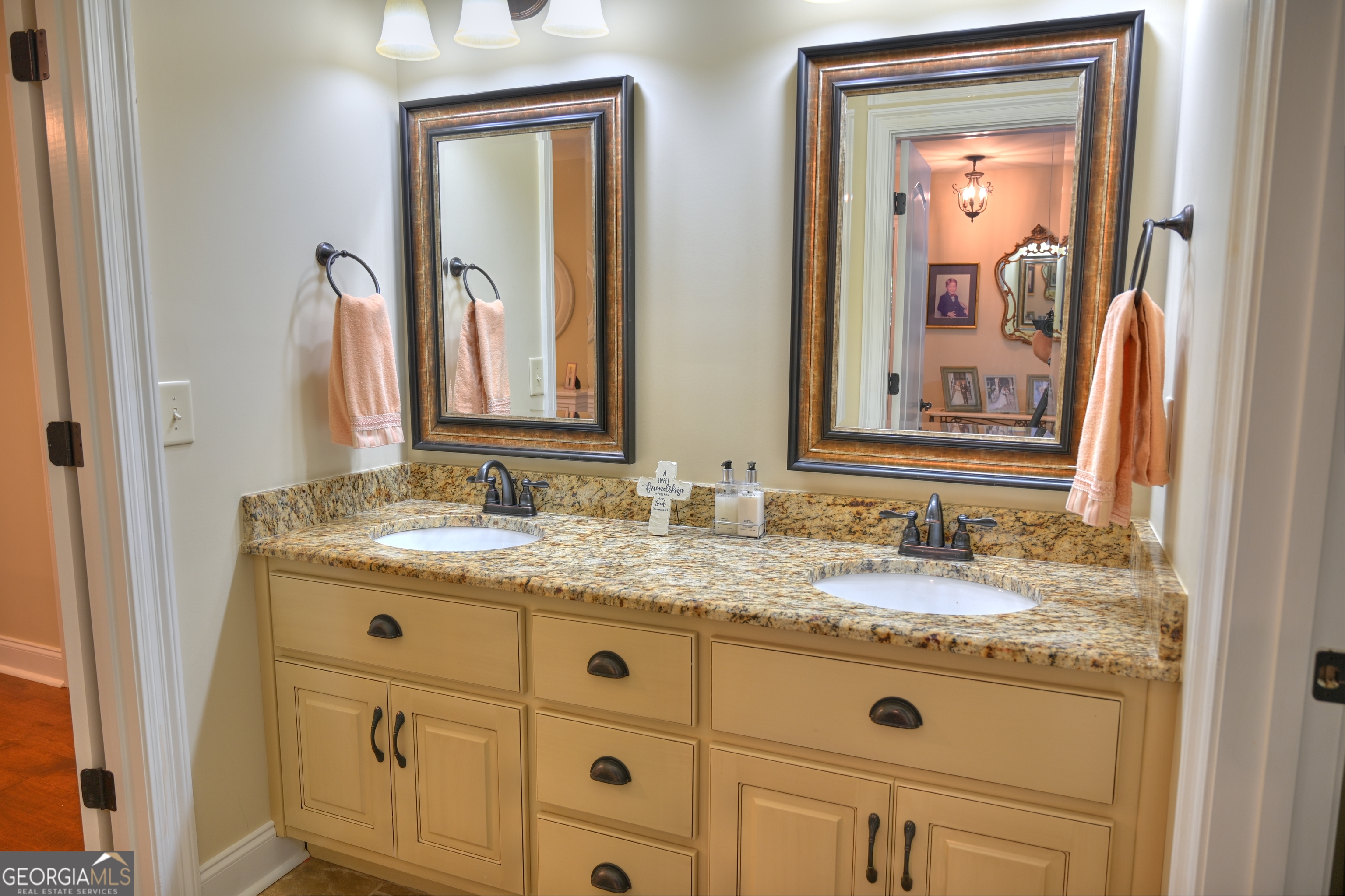 7381 Lullwater Road Columbus, GA 31904 - Photo 23 of 47 a bathroom with a granite countertop sink vanity and mirror