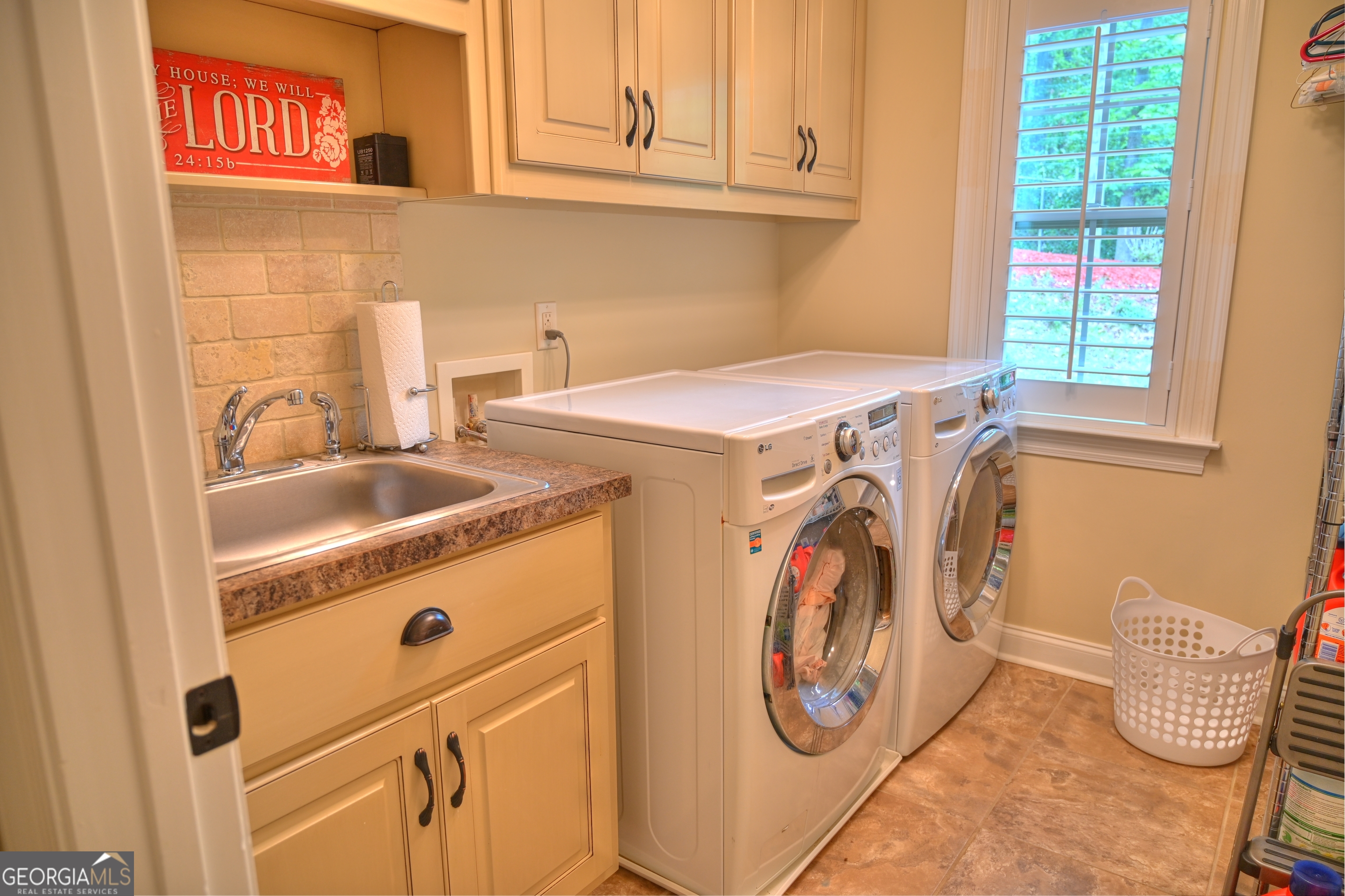 7381 Lullwater Road Columbus, GA 31904 - Photo 27 of 47 a utility room with dryer and washer