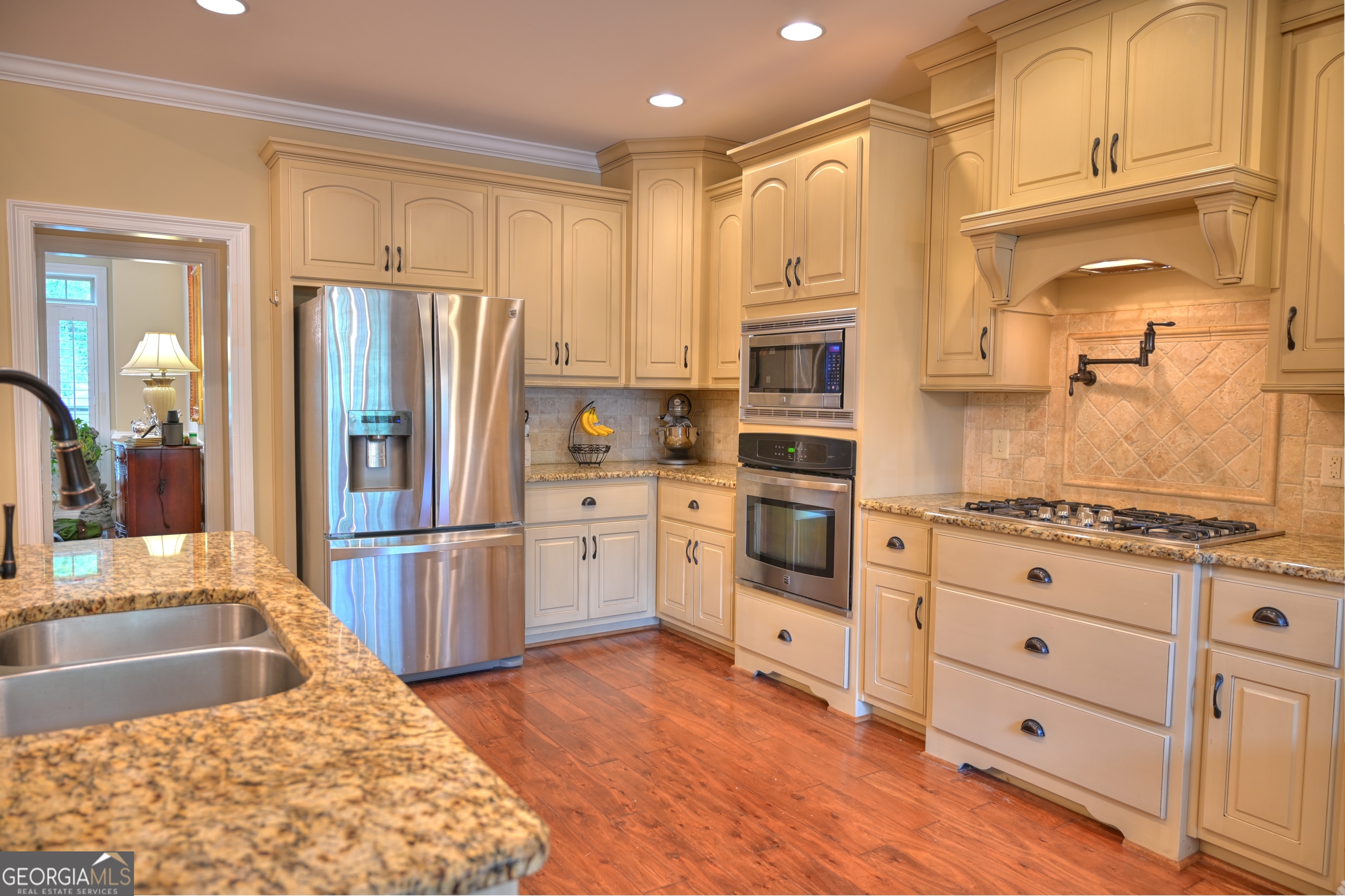 7381 Lullwater Road Columbus, GA 31904 - Photo 28 of 47 a kitchen with stainless steel appliances granite countertop a refrigerator sink and cabinets