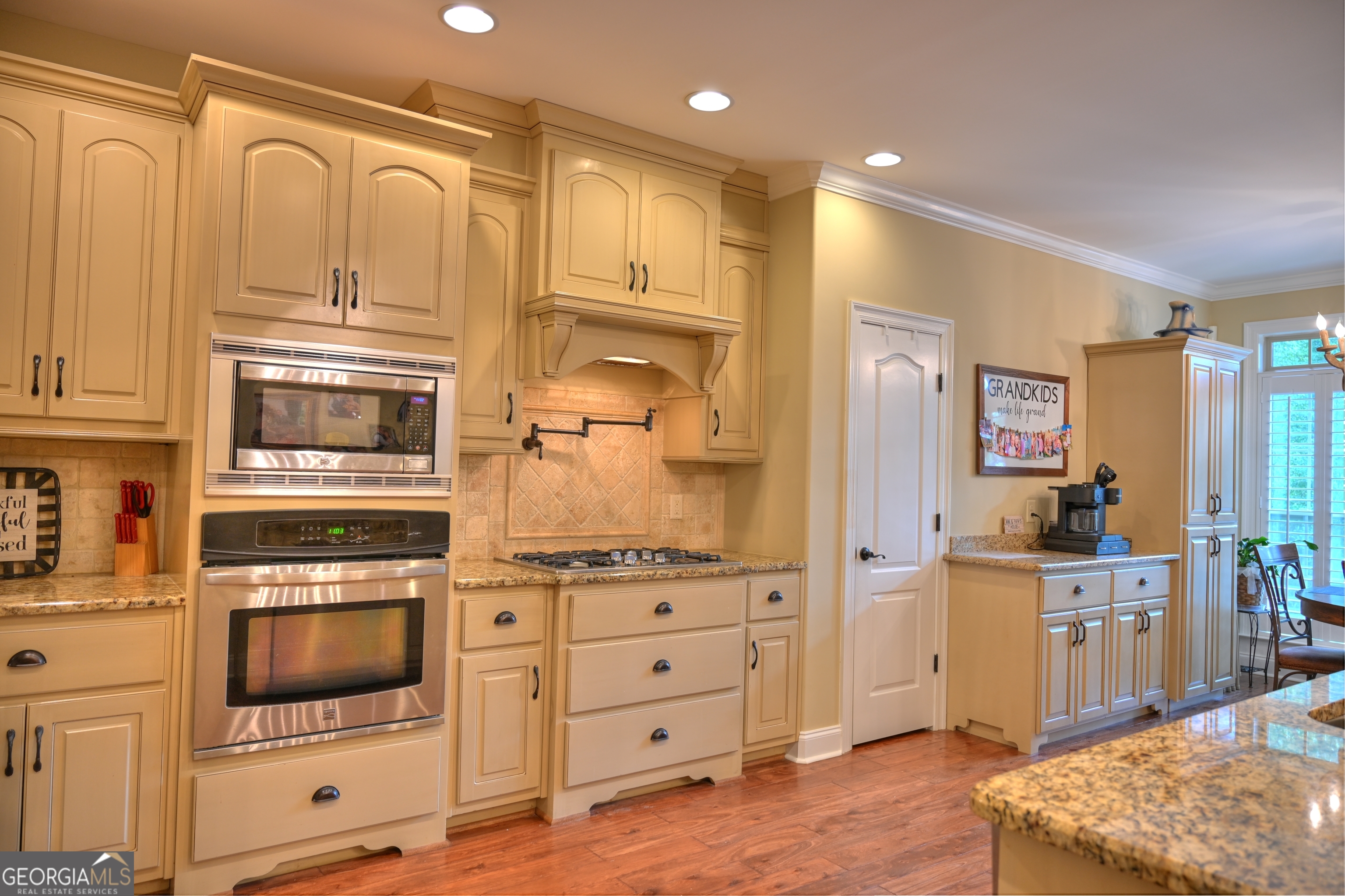 7381 Lullwater Road Columbus, GA 31904 - Photo 29 of 47 a kitchen with stainless steel appliances granite countertop a stove and a refrigerator