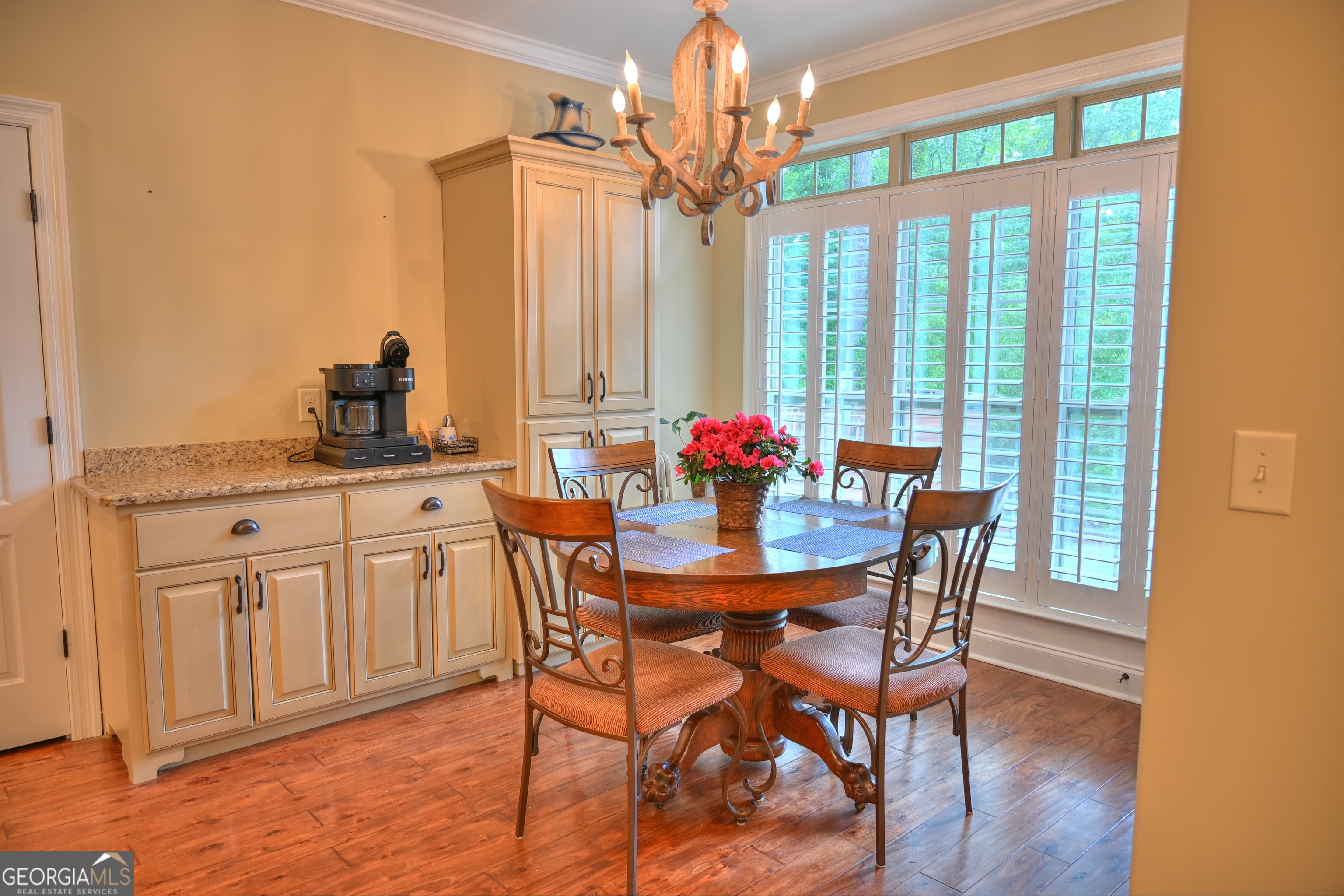 7381 Lullwater Road Columbus, GA 31904 - Photo 30 of 47 a view of a dining room with furniture window and wooden floor