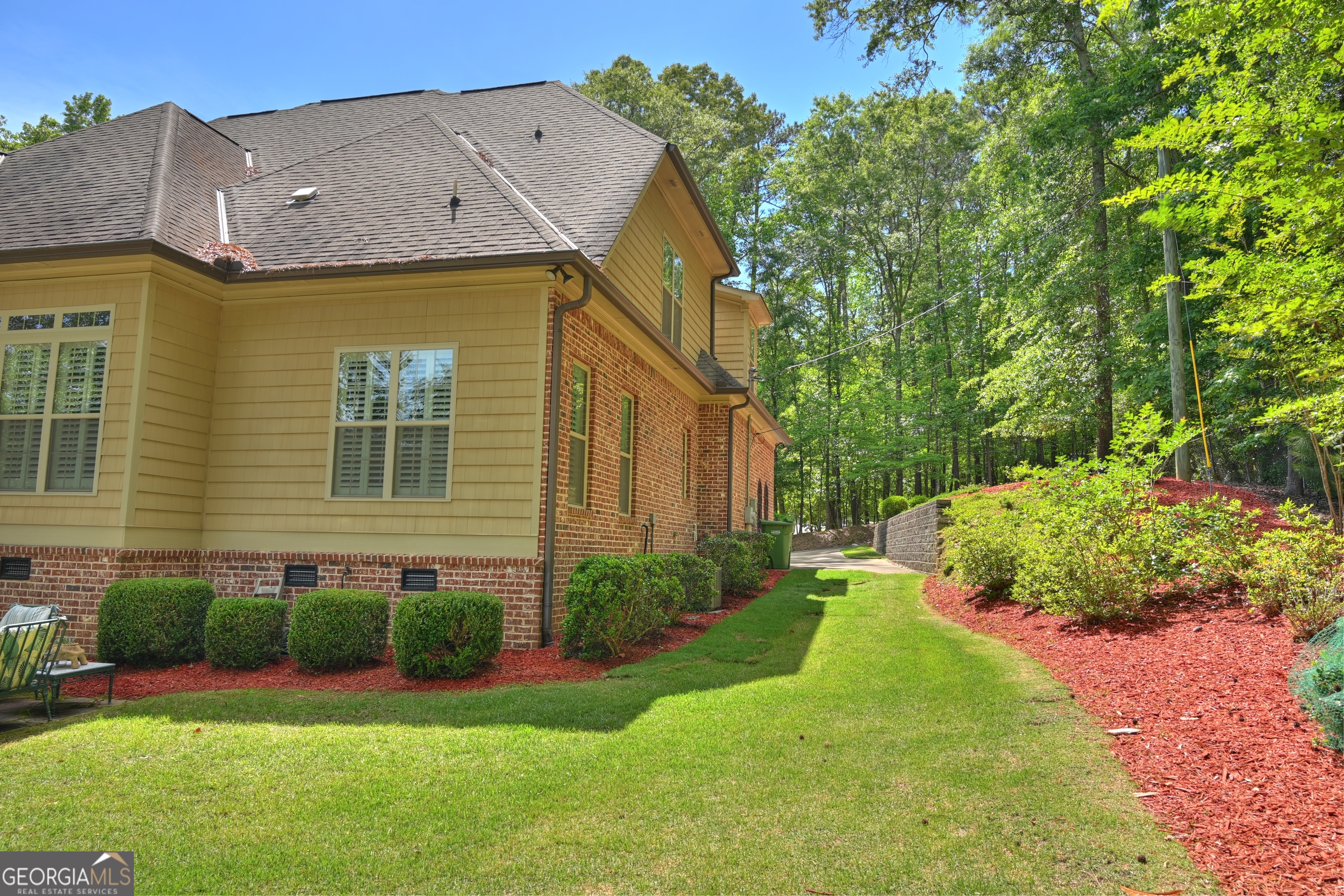 7381 Lullwater Road Columbus, GA 31904 - Photo 34 of 47 a view of a house with a yard and plants