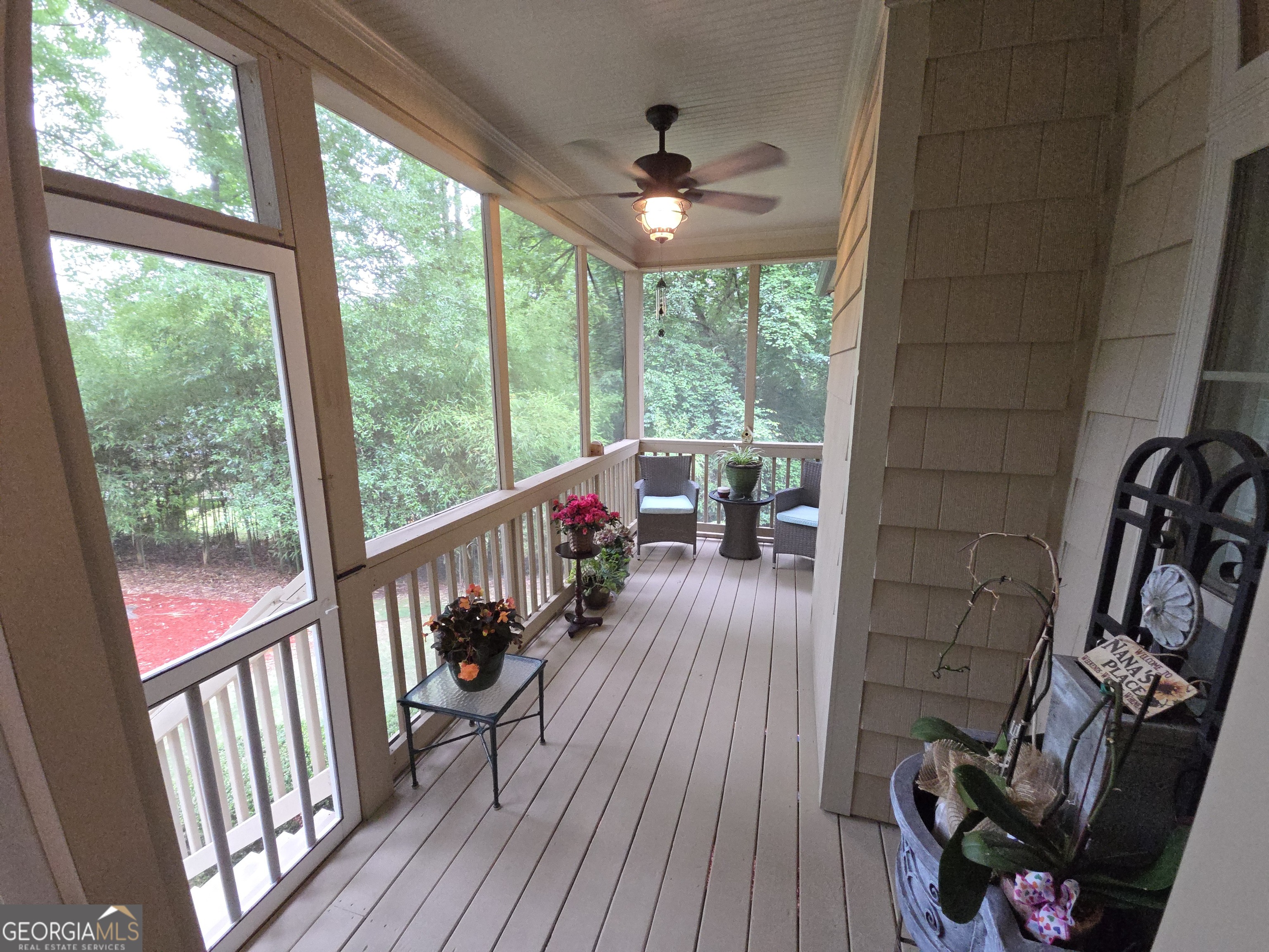 7381 Lullwater Road Columbus, GA 31904 - Photo 36 of 47 a view of a porch with wooden floor