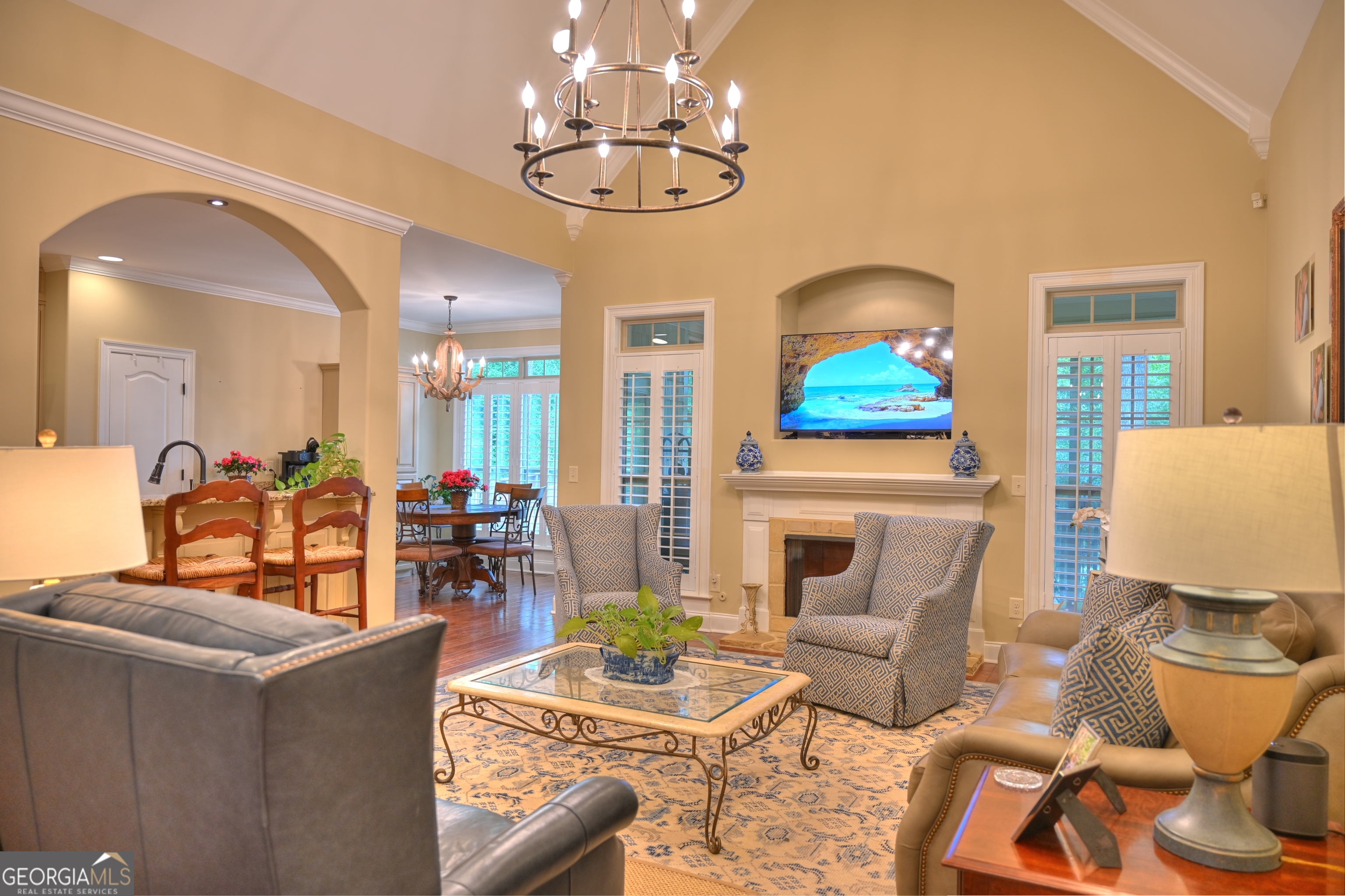 7381 Lullwater Road Columbus, GA 31904 - Photo 40 of 47 a living room with fireplace furniture and a chandelier
