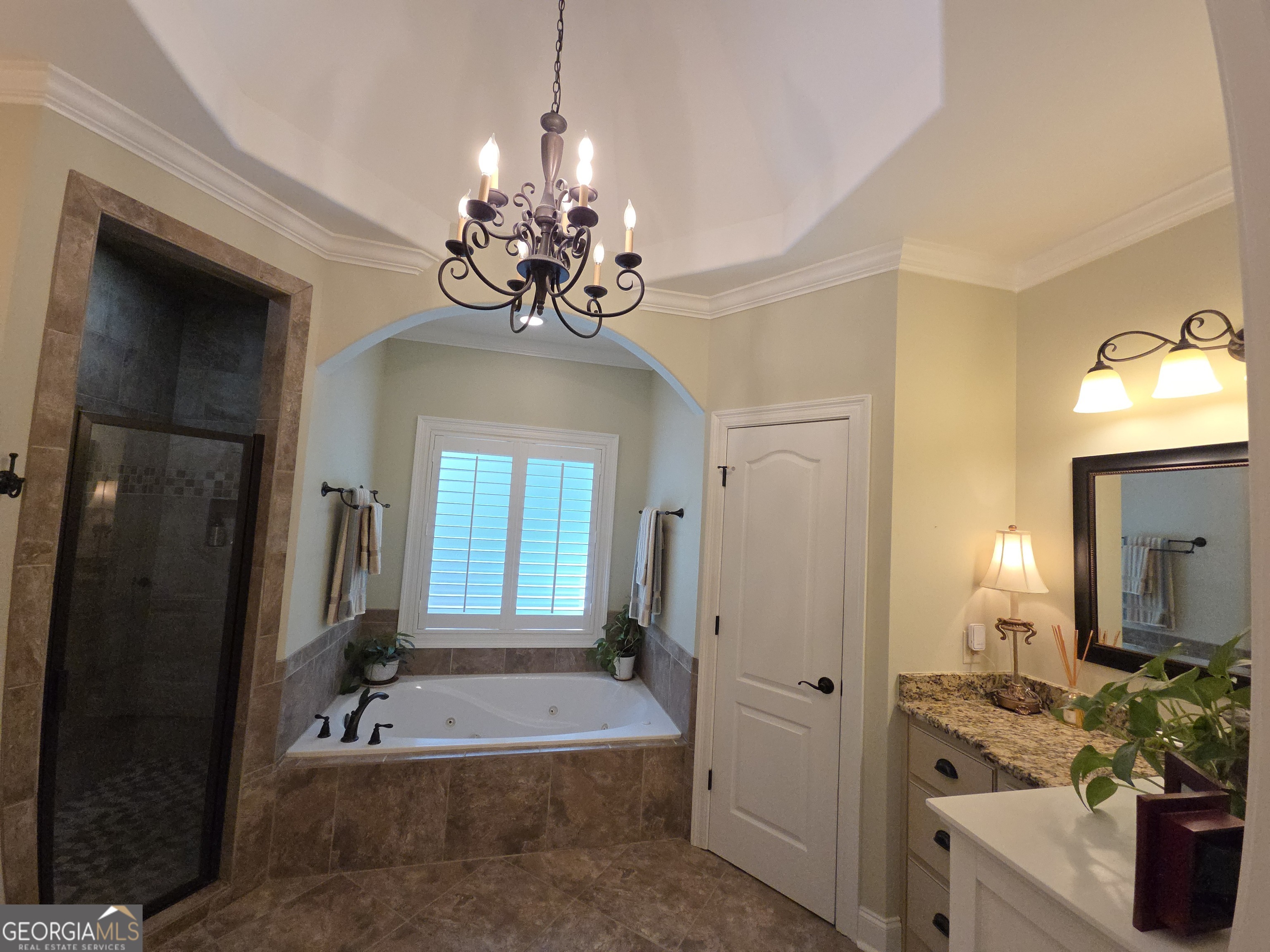 7381 Lullwater Road Columbus, GA 31904 - Photo 8 of 47 a view of a livingroom with chandelier furniture and windows