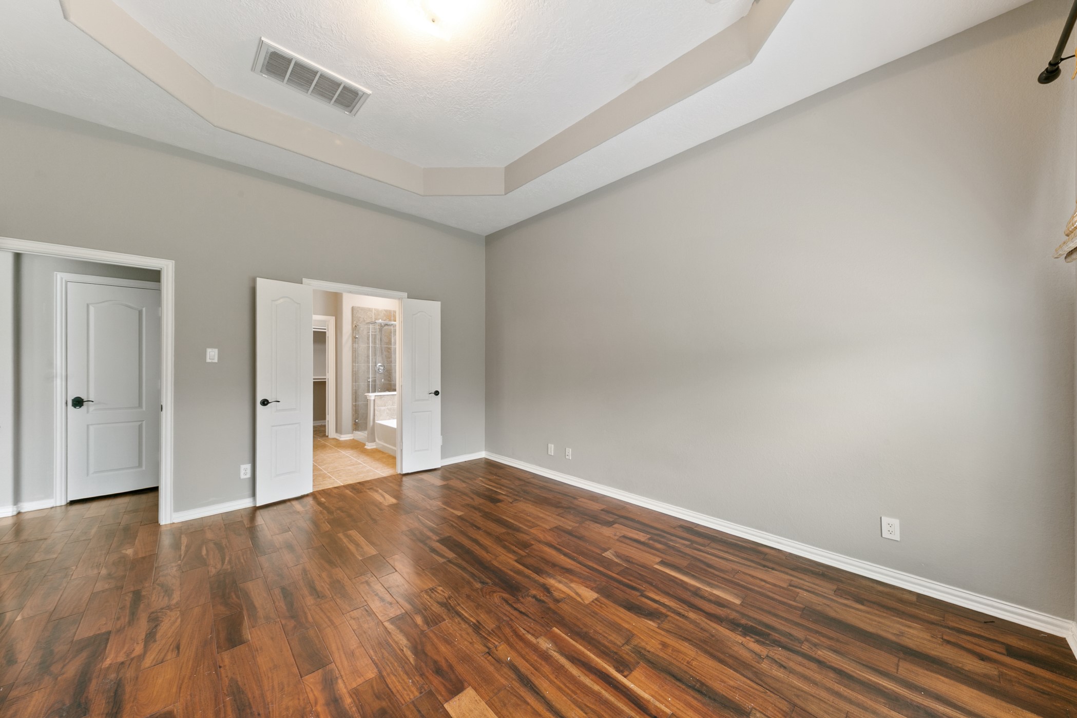 9438 Emerald Lakes Drive Rosharon, TX 77583 - Photo 10 of 36 a view of an empty room and wooden floor
