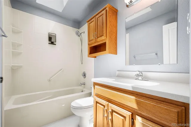 an empty room with window and ceiling fan