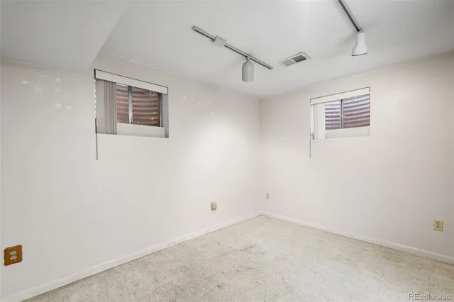 a view of a wooden deck with a yard