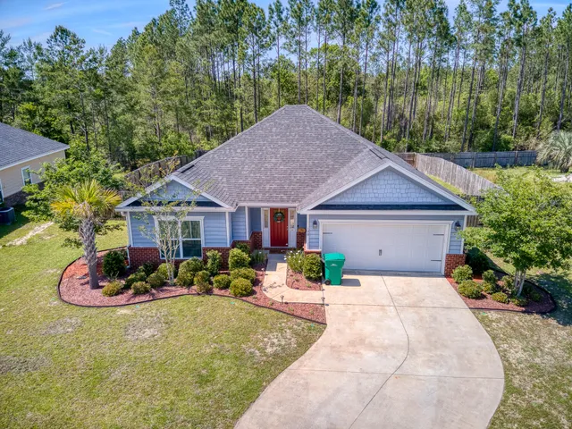 a front view of a house with yard