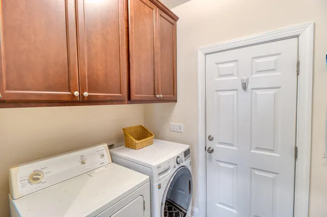 a view of storage and utility room with washer and dryer
