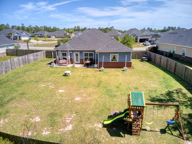 a front view of a house with a swimming pool