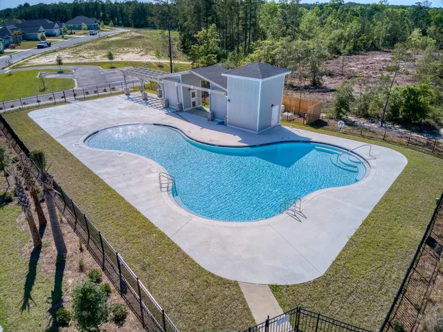 an aerial view of a house having swimming pool