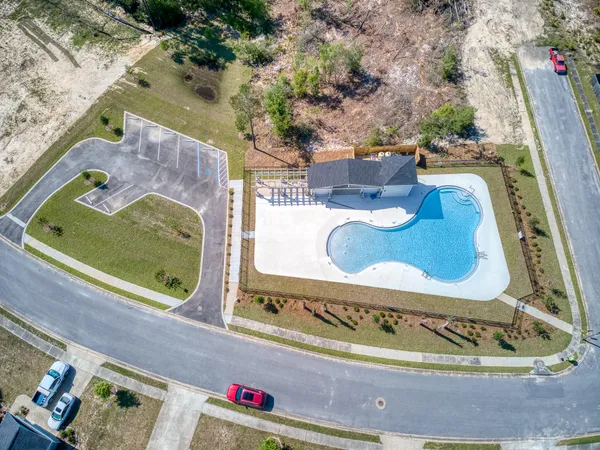 swimming pool view with a outdoor seating space