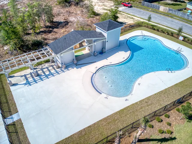 a view of swimming pool with a patio