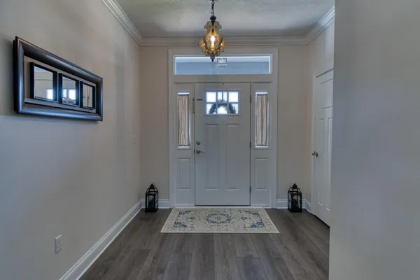 wooden floor in a hall with a window