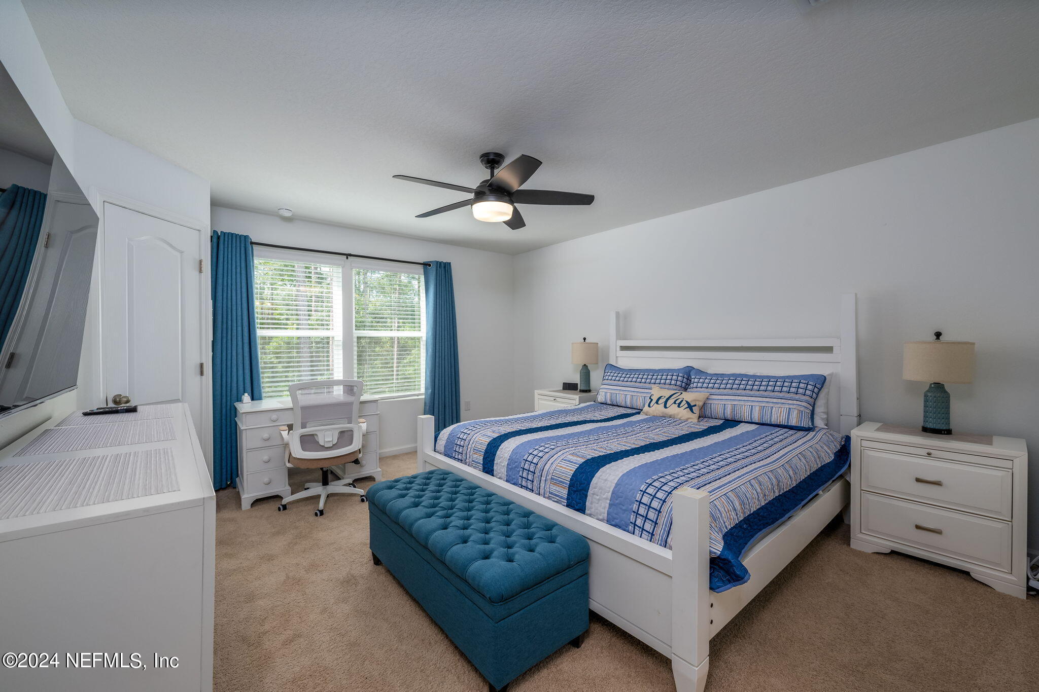 32 Vero Drive St. Augustine, FL 32095 - Photo 20 of 40 a bedroom with a bed a couch and a window