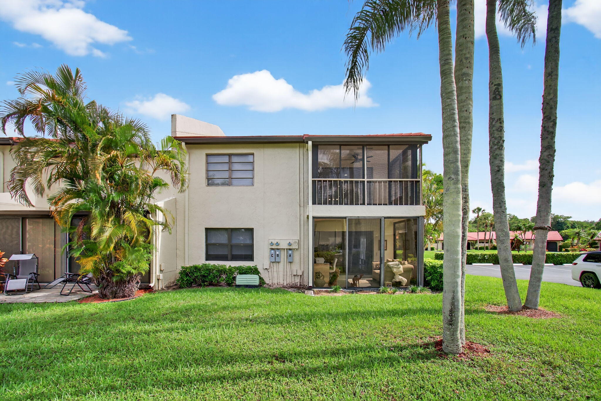 8536 Casa Del Lago, Unit 49B Boca Raton, FL 33433 - Photo 47 of 79 a front view of a house with a yard