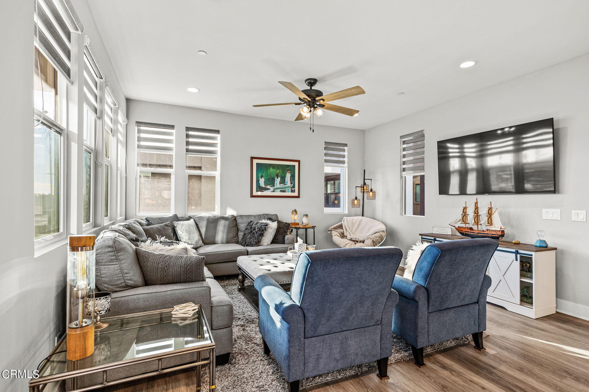1051 Canal Street Oxnard, CA 93035 - Photo 13 of 54 a living room with furniture ceiling fan and a window