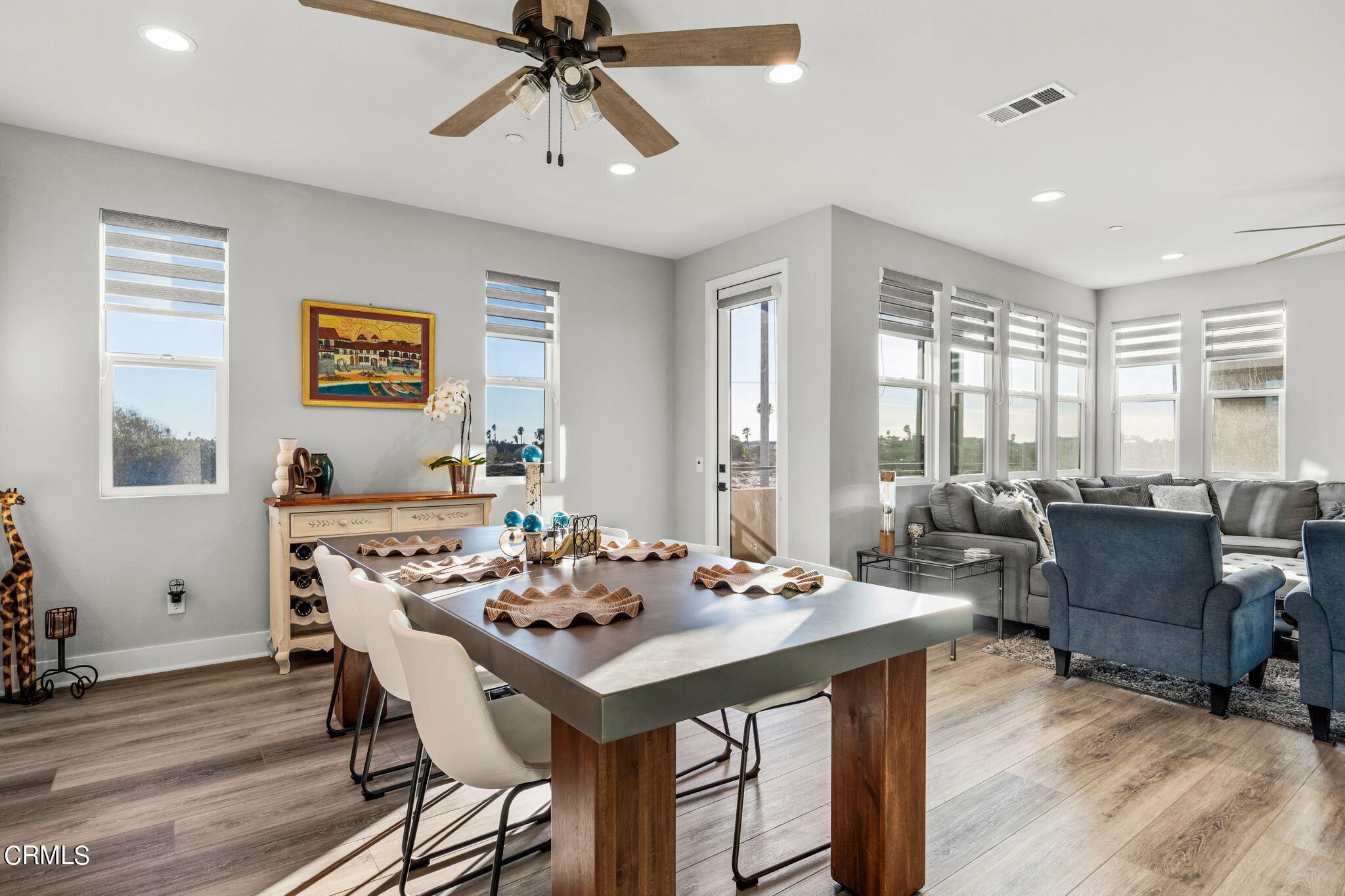 1051 Canal Street Oxnard, CA 93035 - Photo 16 of 54 a view of a a dining room with furniture window and wooden floor