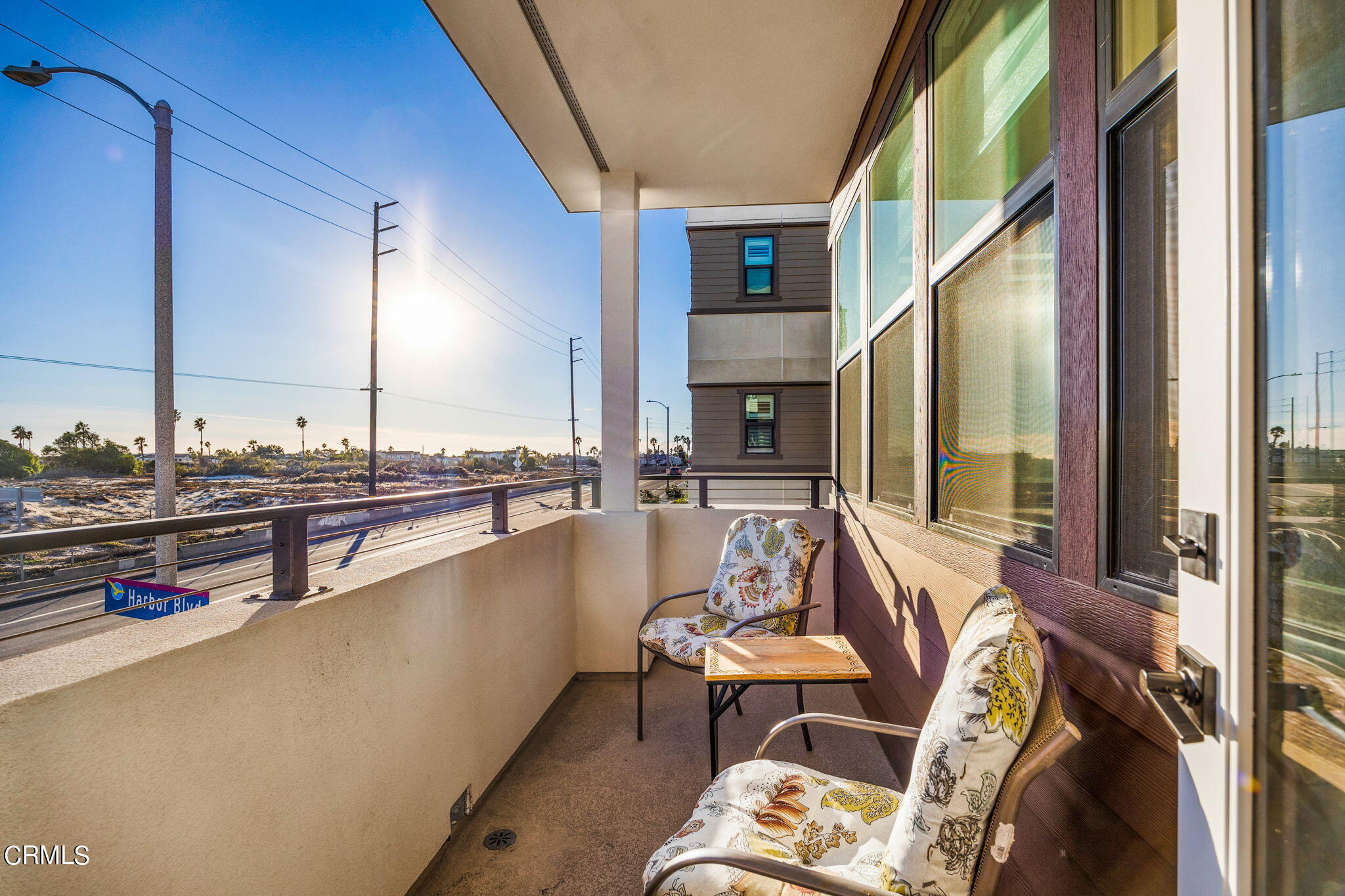 1051 Canal Street Oxnard, CA 93035 - Photo 17 of 54 a living room with furniture a rug and a large window
