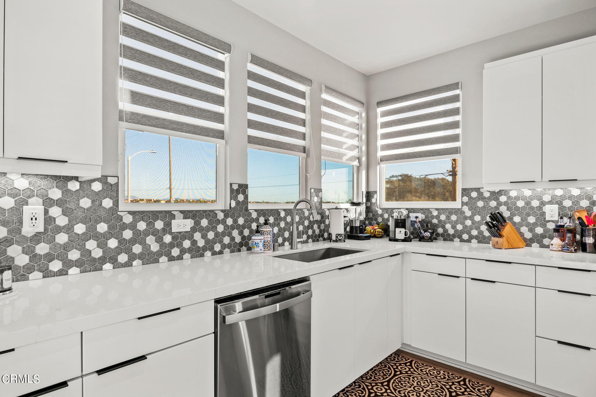 1051 Canal Street Oxnard, CA 93035 - Photo 22 of 54 a kitchen with sink cabinets and window