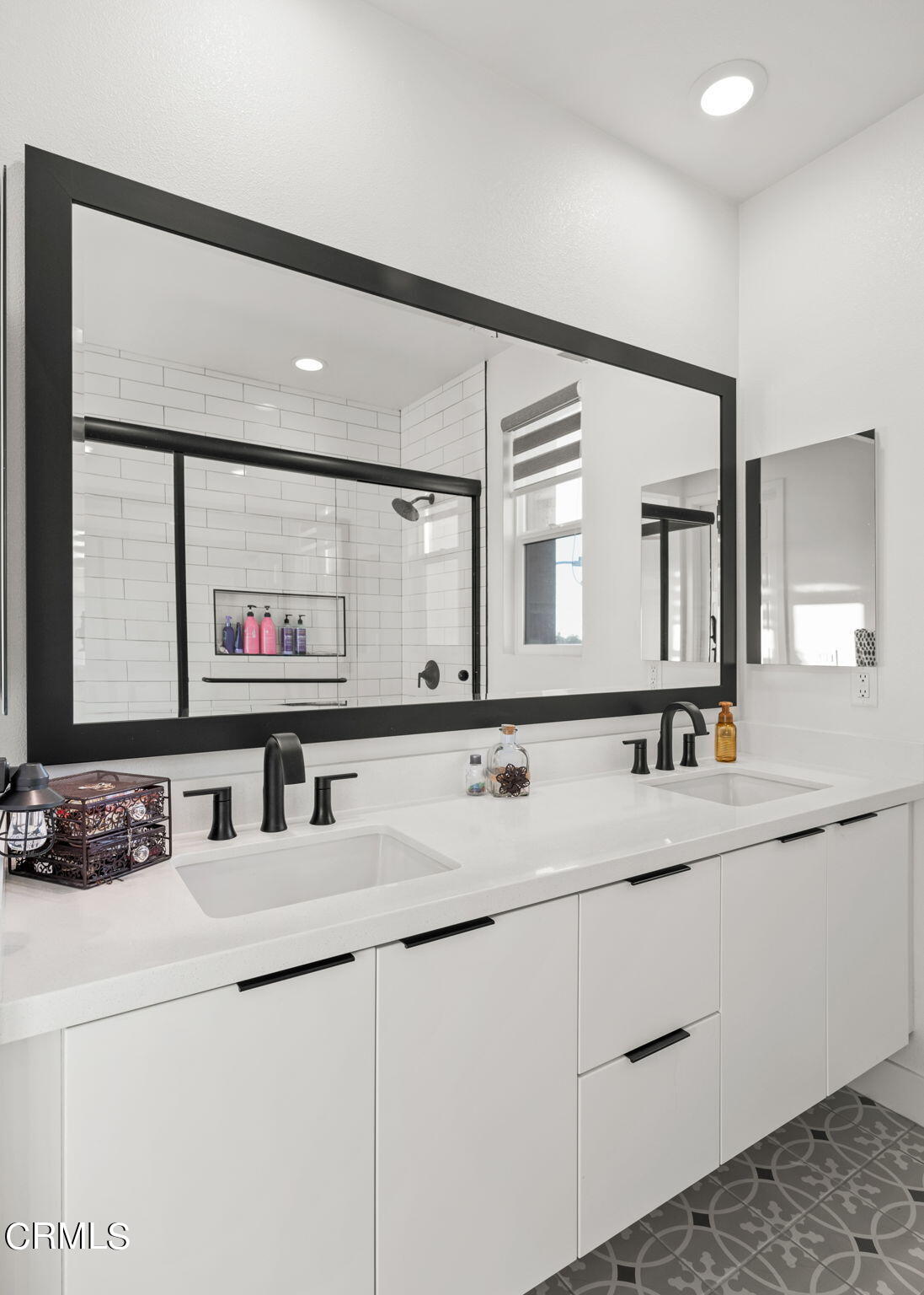 1051 Canal Street Oxnard, CA 93035 - Photo 30 of 54 a bathroom with a sink and a mirror