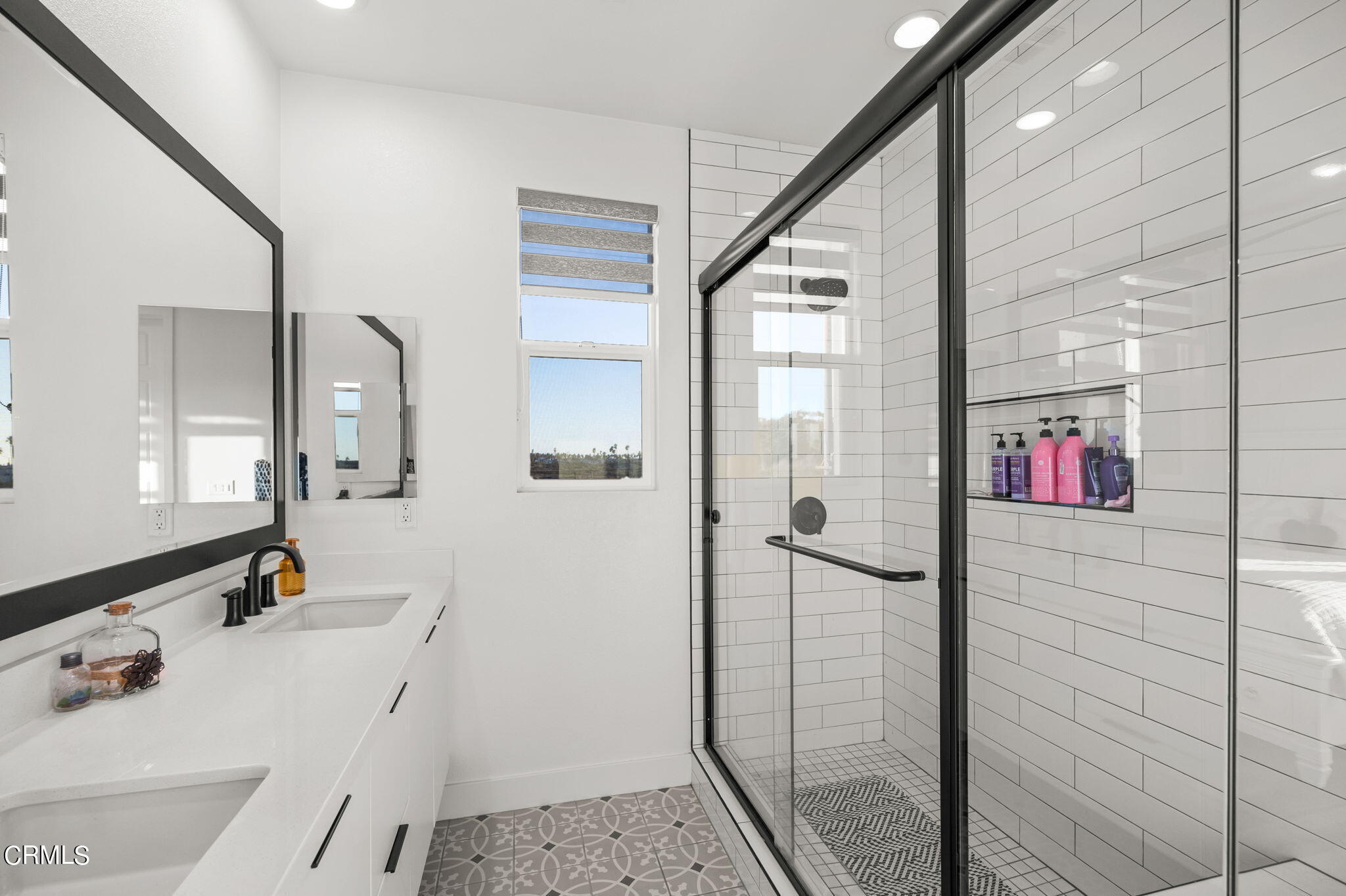 1051 Canal Street Oxnard, CA 93035 - Photo 31 of 54 a bathroom with a tub shower vanity and a sink