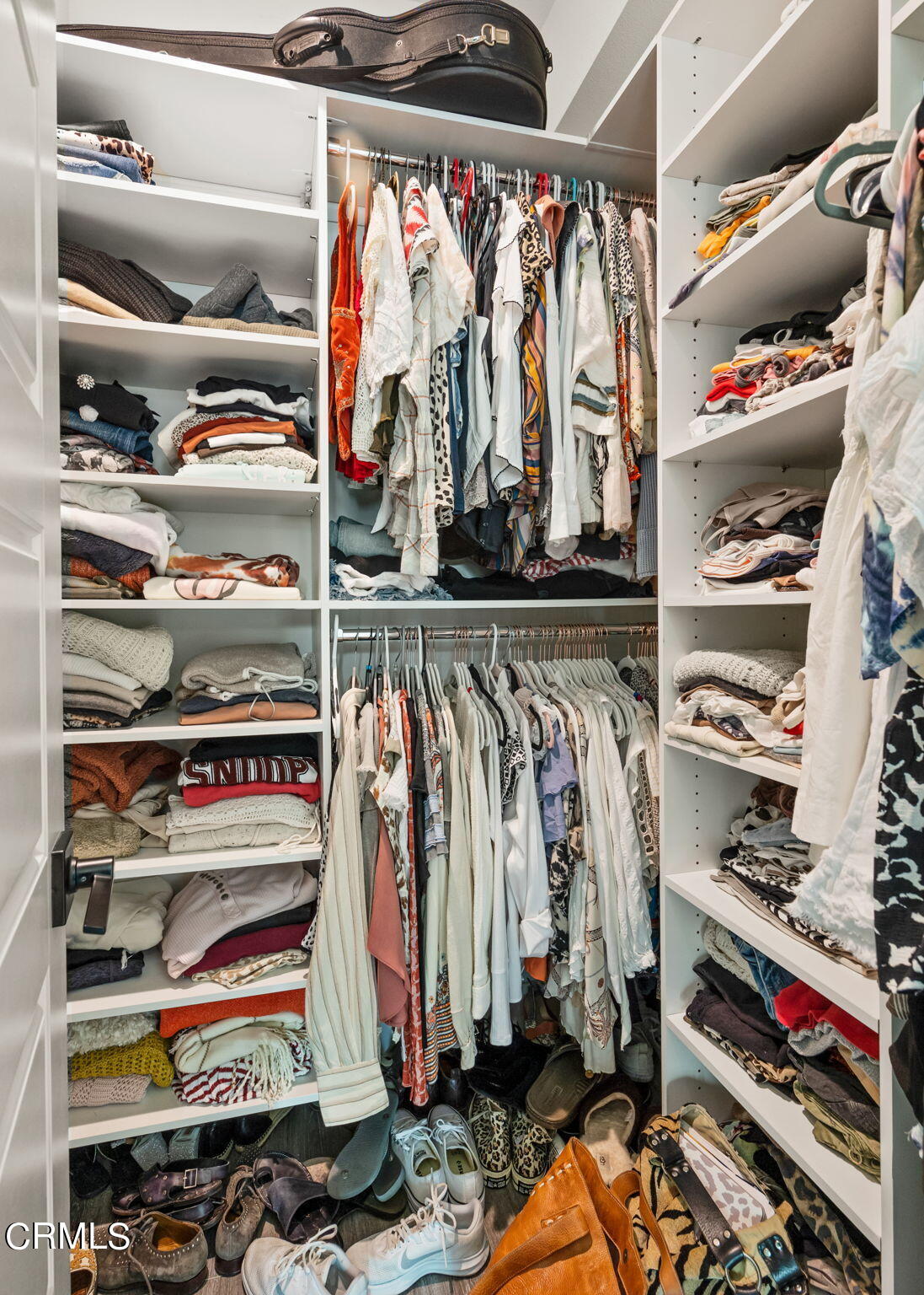 1051 Canal Street Oxnard, CA 93035 - Photo 32 of 54 a view of walk in closet with clothes and shoes