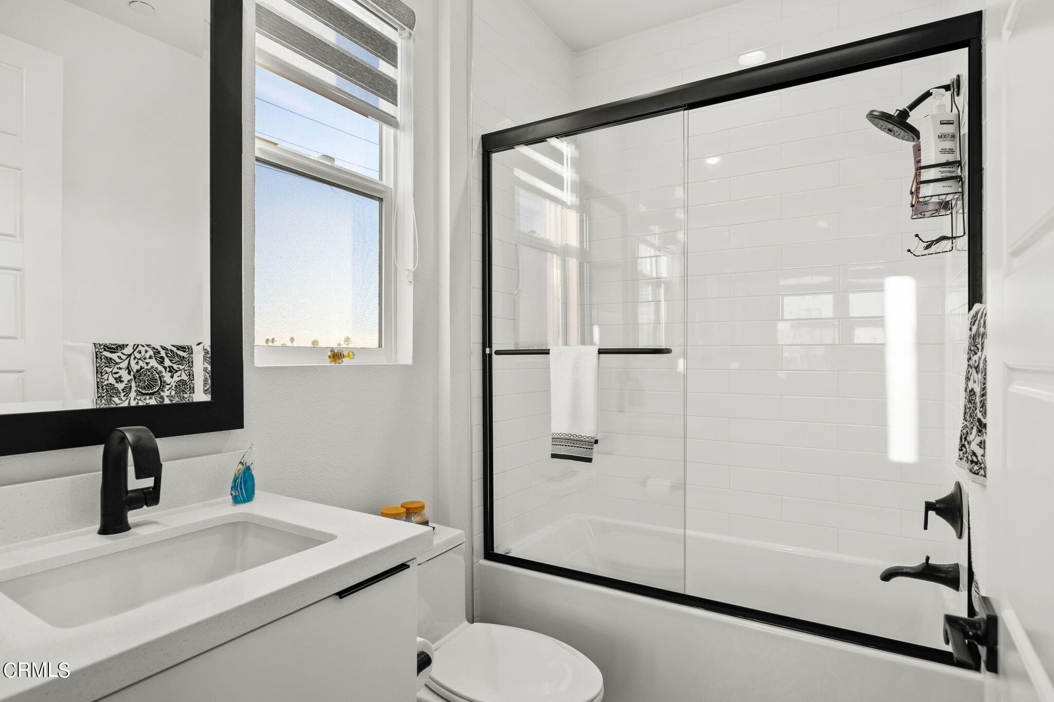 1051 Canal Street Oxnard, CA 93035 - Photo 35 of 54 a bathroom with a sink toilet and shower