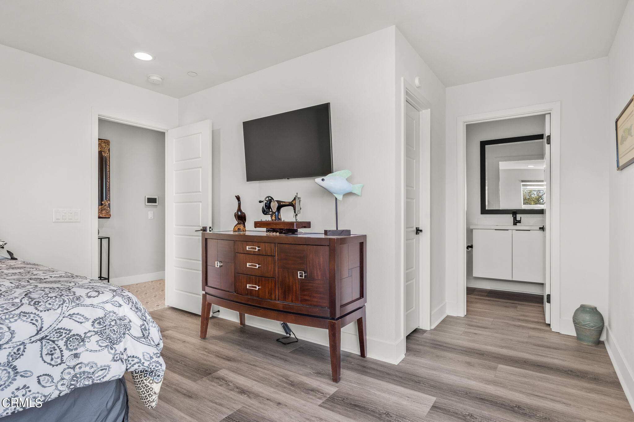 1051 Canal Street Oxnard, CA 93035 - Photo 40 of 54 a bedroom with a bed and a flat screen tv